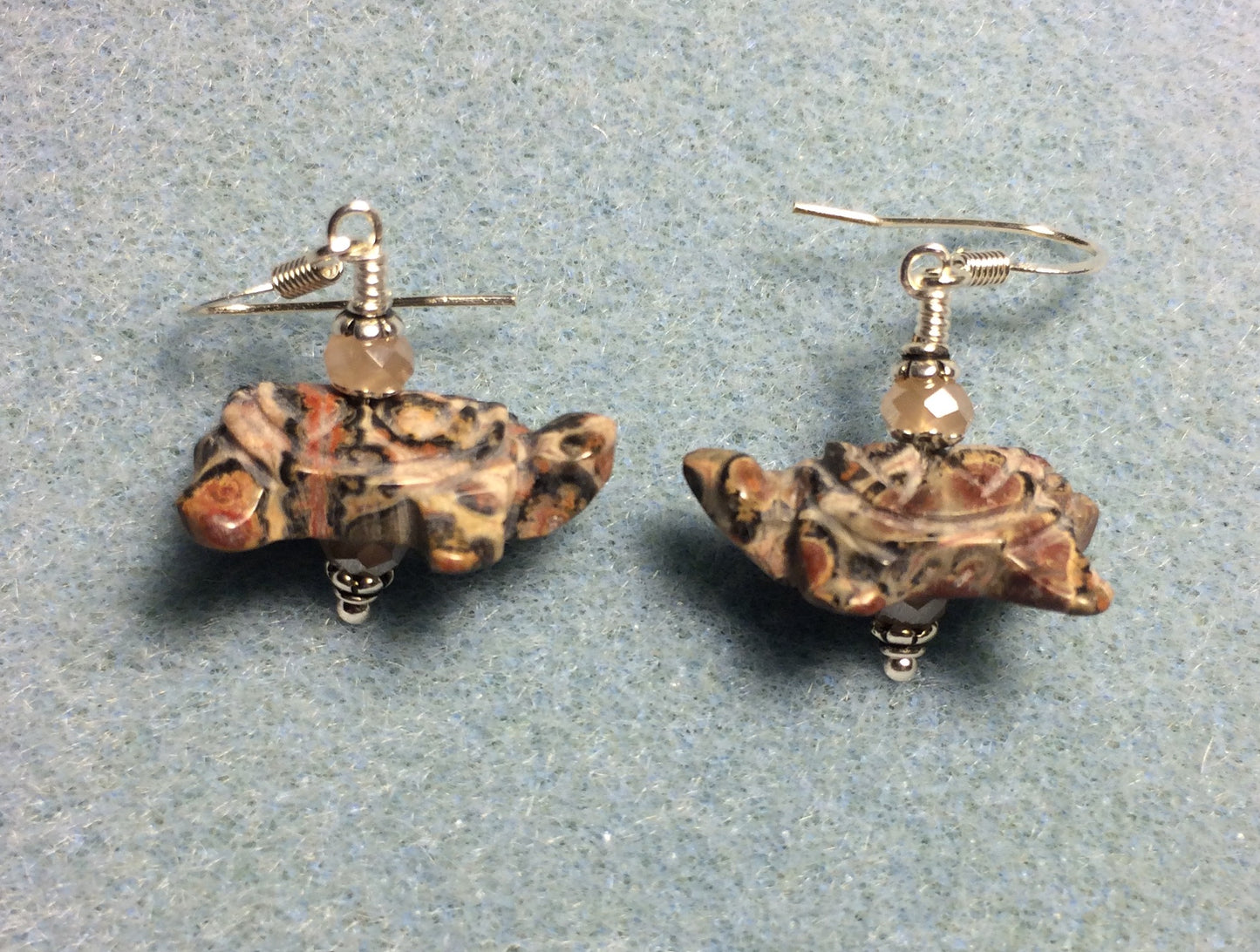 Pink leopard skin jasper gemstone turtle bead earrings adorned with peach Chinese crystal beads.