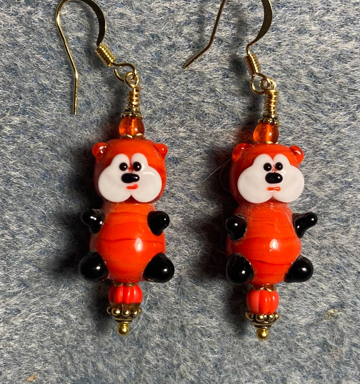 Large opaque red and white lamp work teddy bear bead earrings adorned with opaque red Czech glass beads.