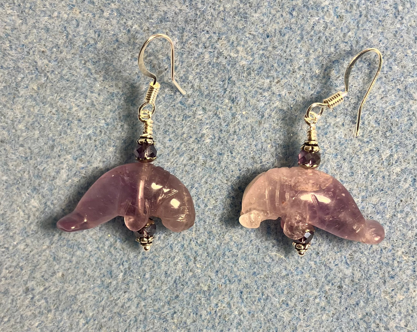 Purple amethyst gemstone manatee bead earrings adorned with purple Chinese crystal beads.
