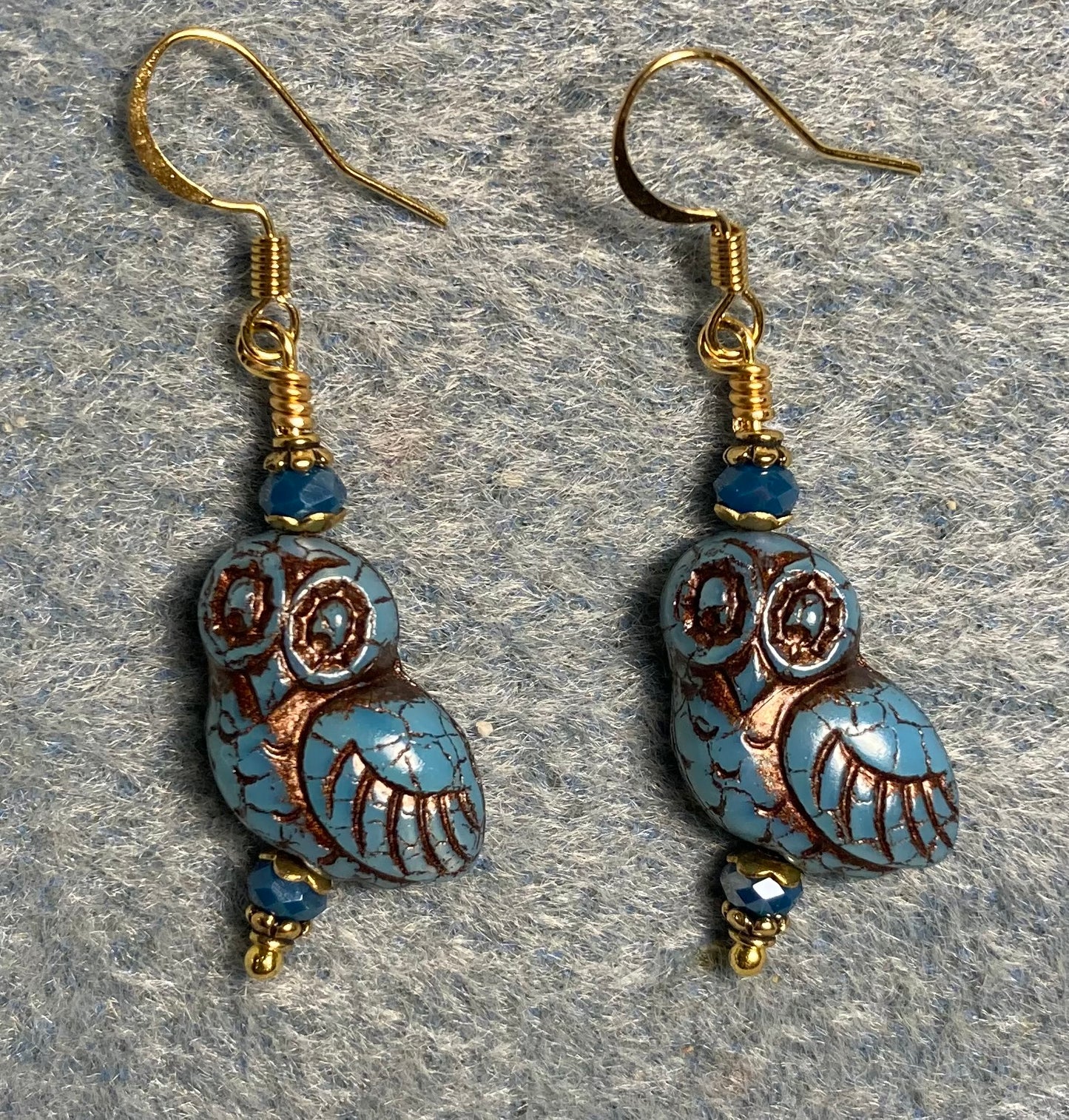 Blue (with copper wash) fancy Czech glass owl bead earrings adorned with blue Chinese crystal beads.