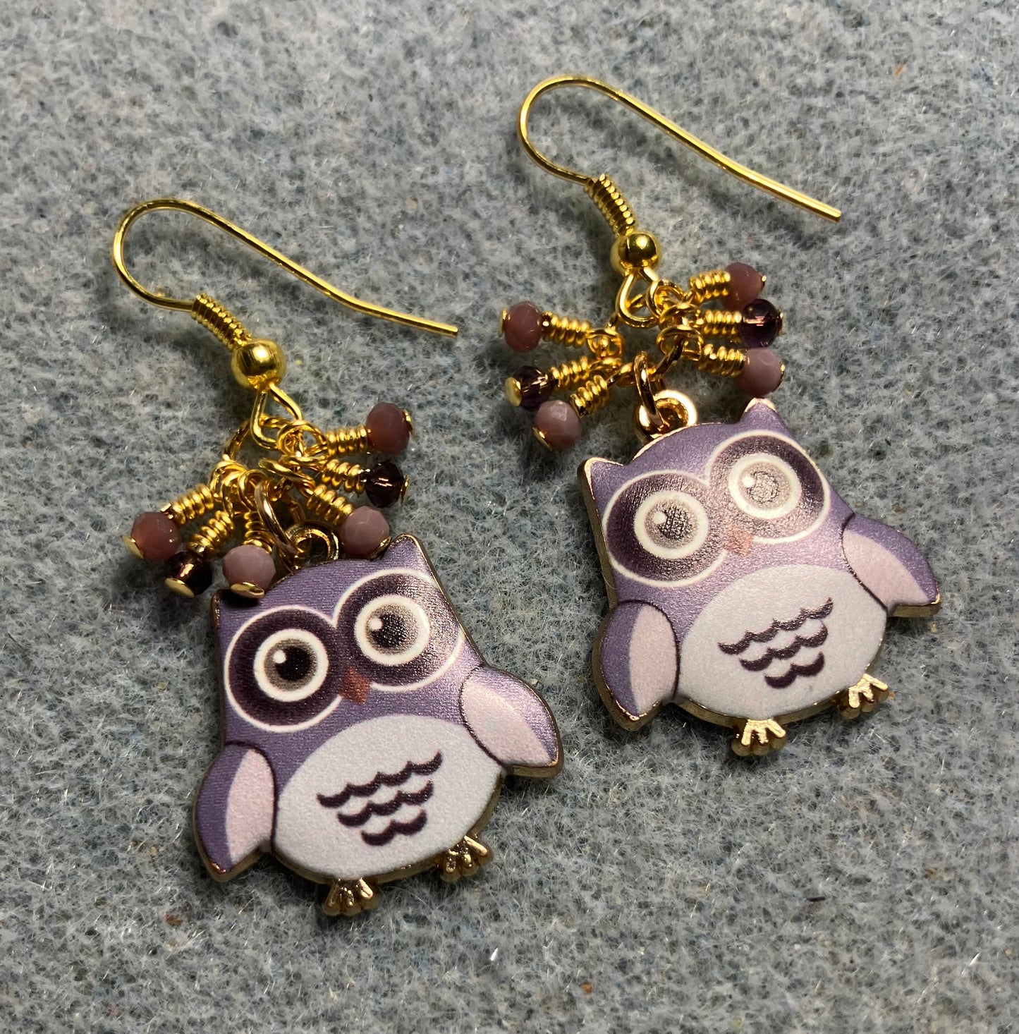 Violet and purple enamel owl charm earrings adorned with tiny dangling violet and purple Chinese crystal beads.