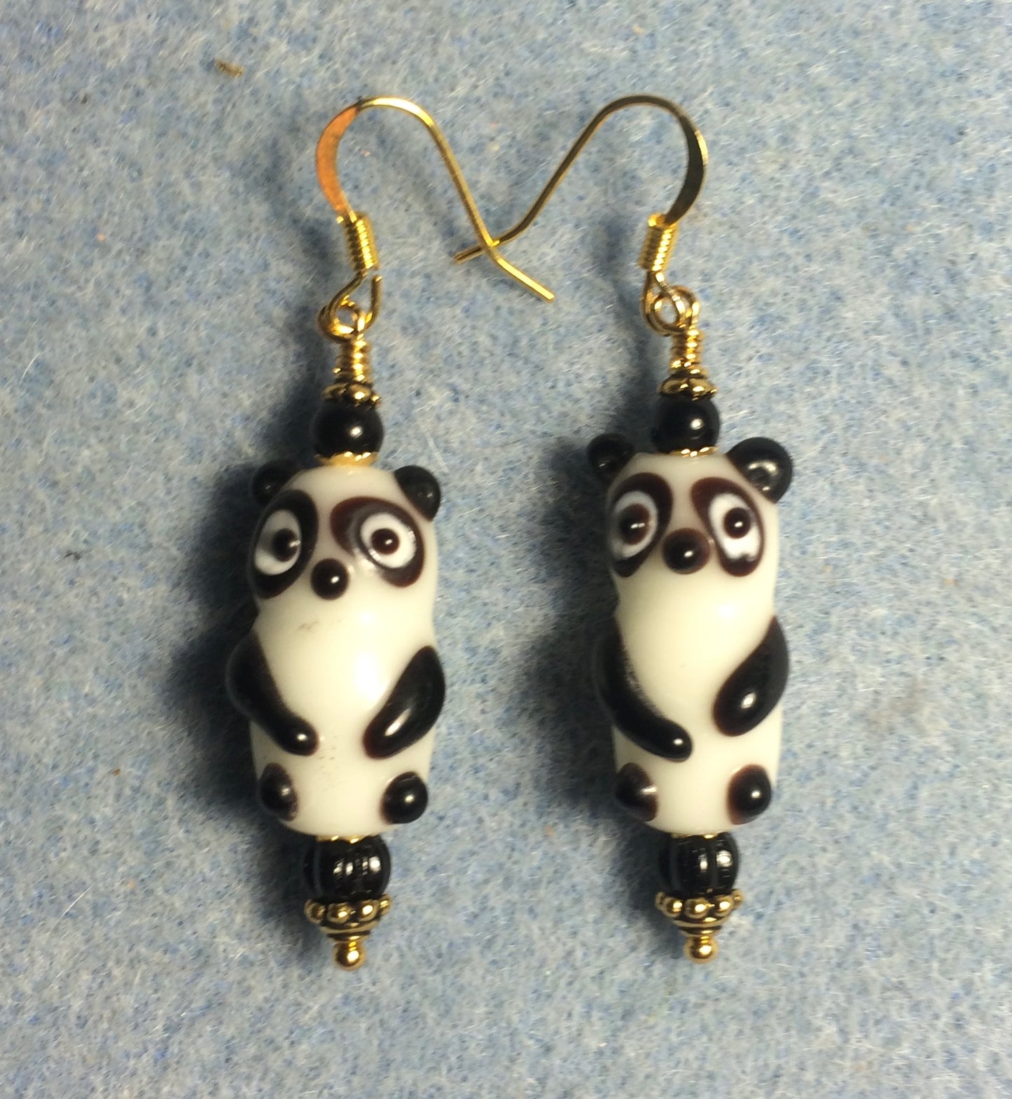 Black and white lamp work panda bear bead earrings adorned with black Czech glass beads.