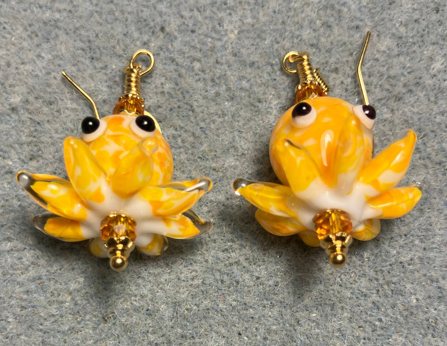 Tangerine and white mottled lamp work octopus bead earrings adorned with tangerine Chinese crystal beads.