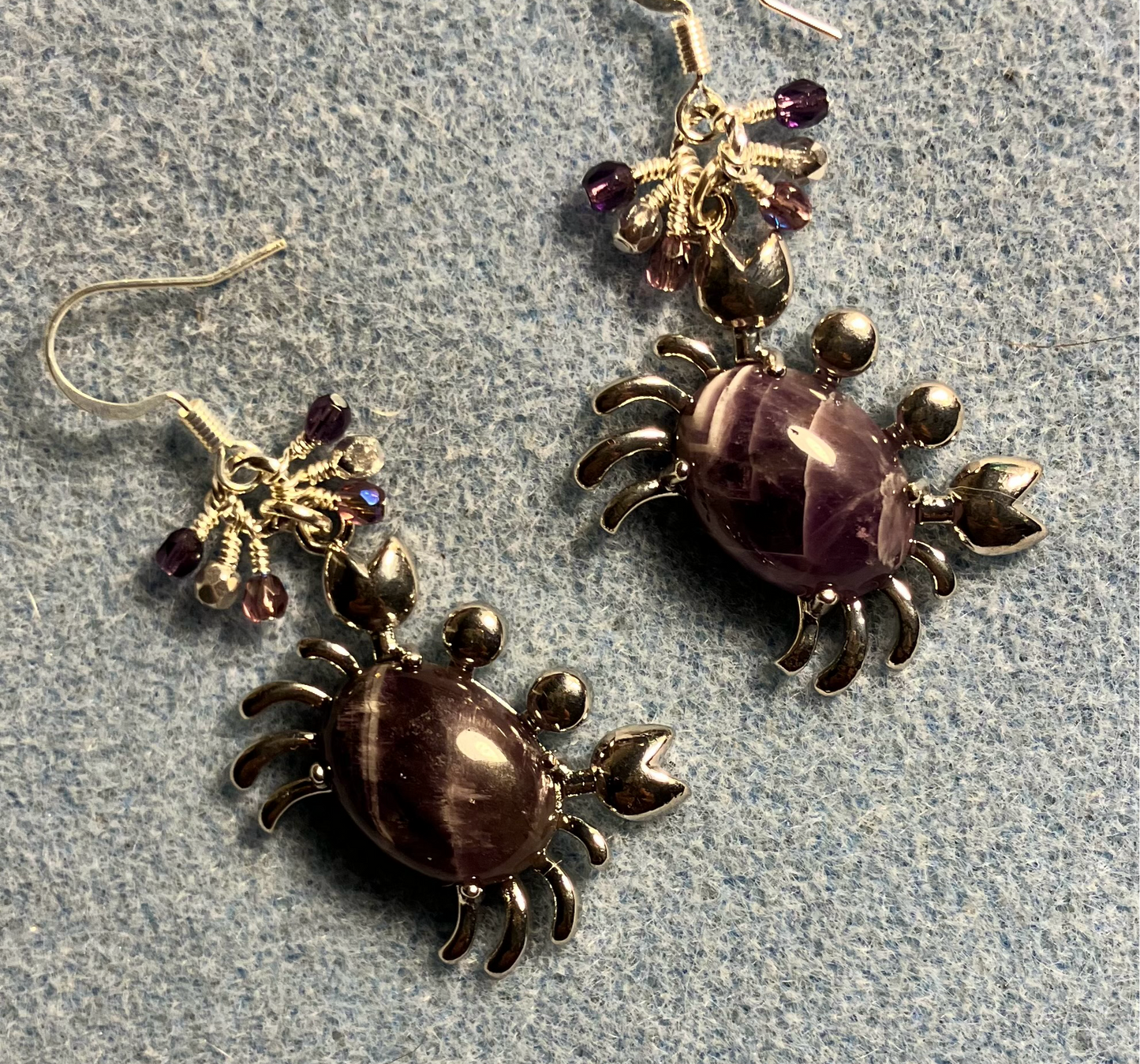 Silver and amethyst gemstone crab charm earrings adorned with small dangling purple and silver Czech glass beads.
