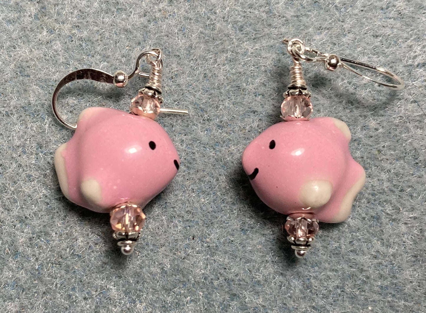 Small pink ceramic fish bead earrings adorned with pink Chinese crystal beads.