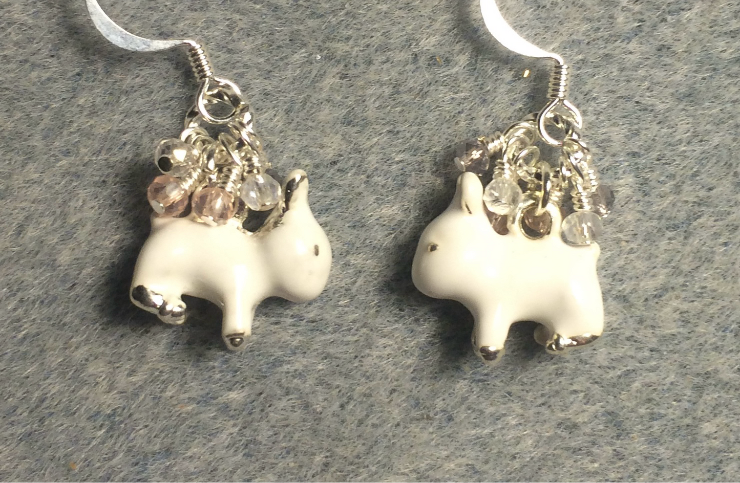 Silver and white enamel rabbit charm earrings adorned with white and silver Chinese crystal beads.
