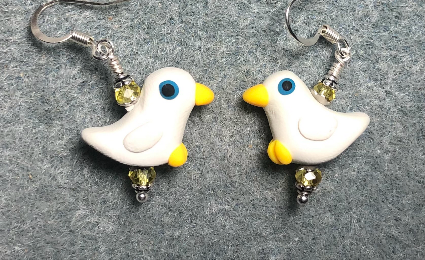 White and yellow polymer clay duck bead earrings adorned with yellow Chinese crystal beads.