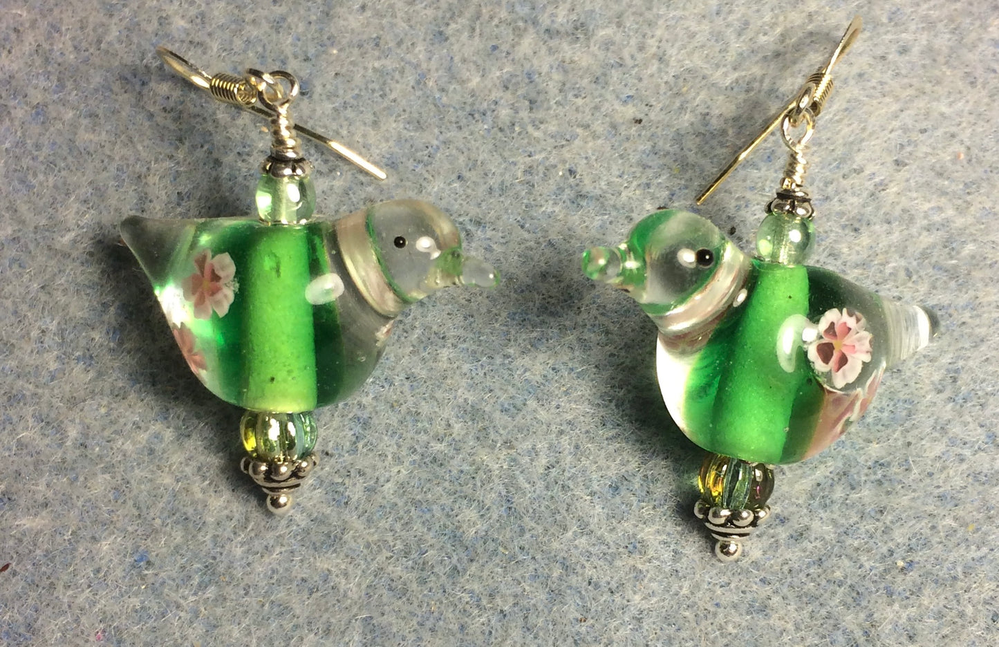 Translucent bright green lamp work songbird bead earrings adorned with green Czech glass beads.