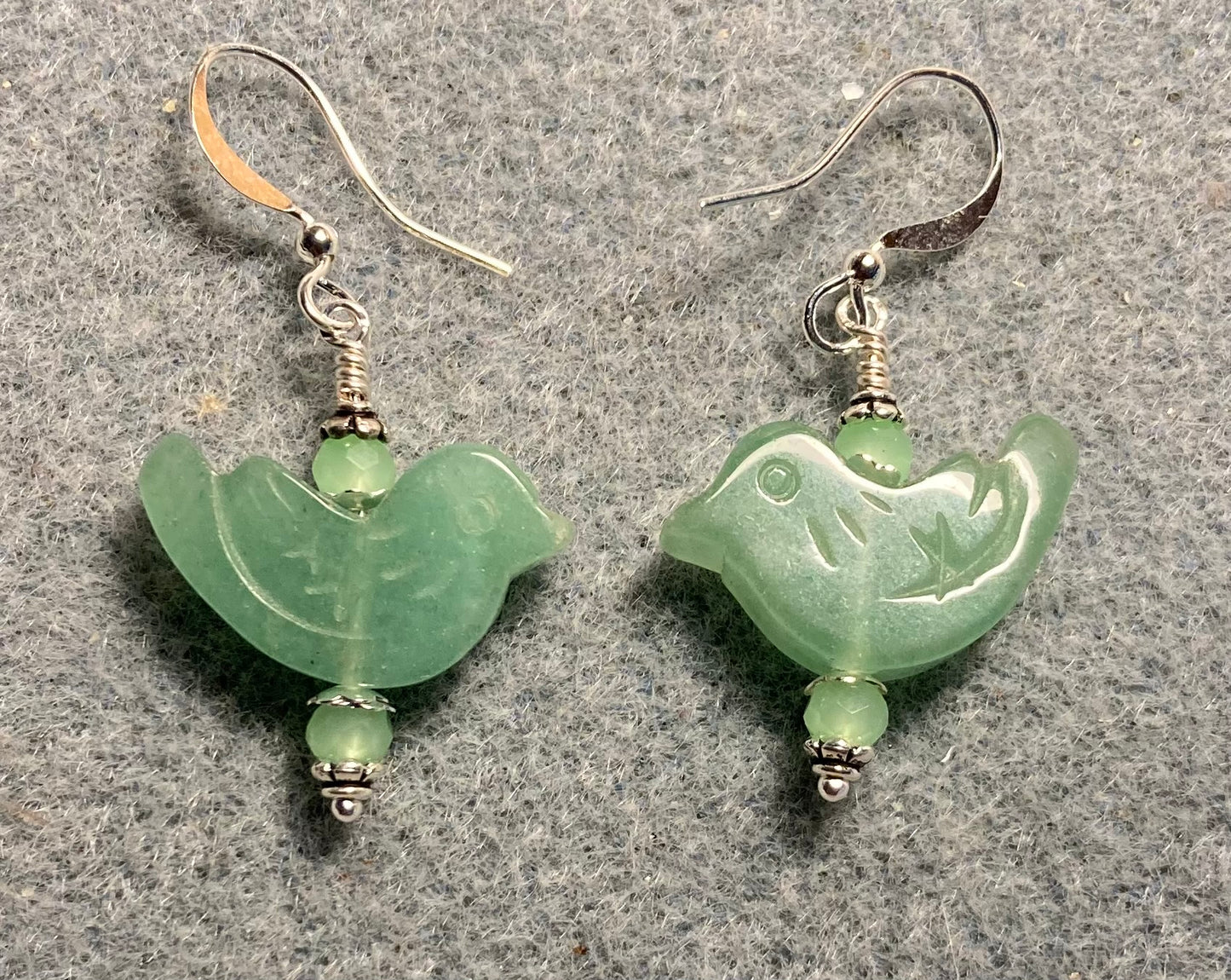 Green aventurine gemstone bird bead earrings adorned with green Chinese crystal beads.