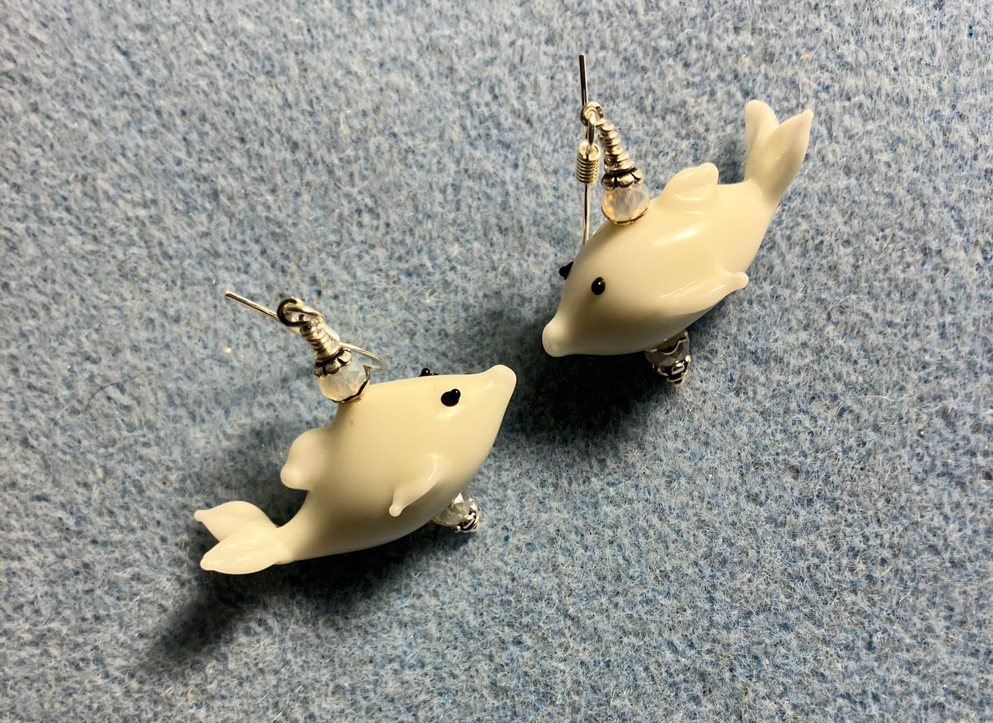 White lamp work whale bead earrings adorned with white Chinese crystal beads.