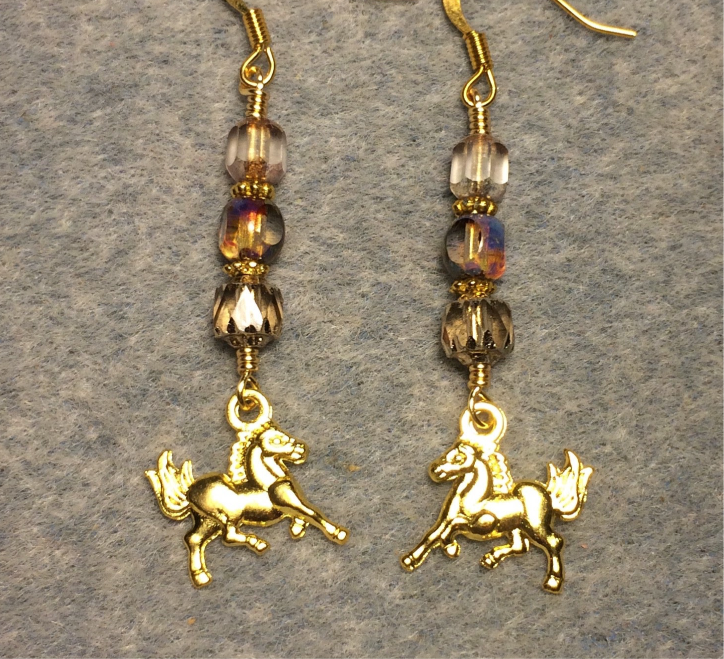 Small gold horse charm earrings adorned with goldish clear Czech glass beads