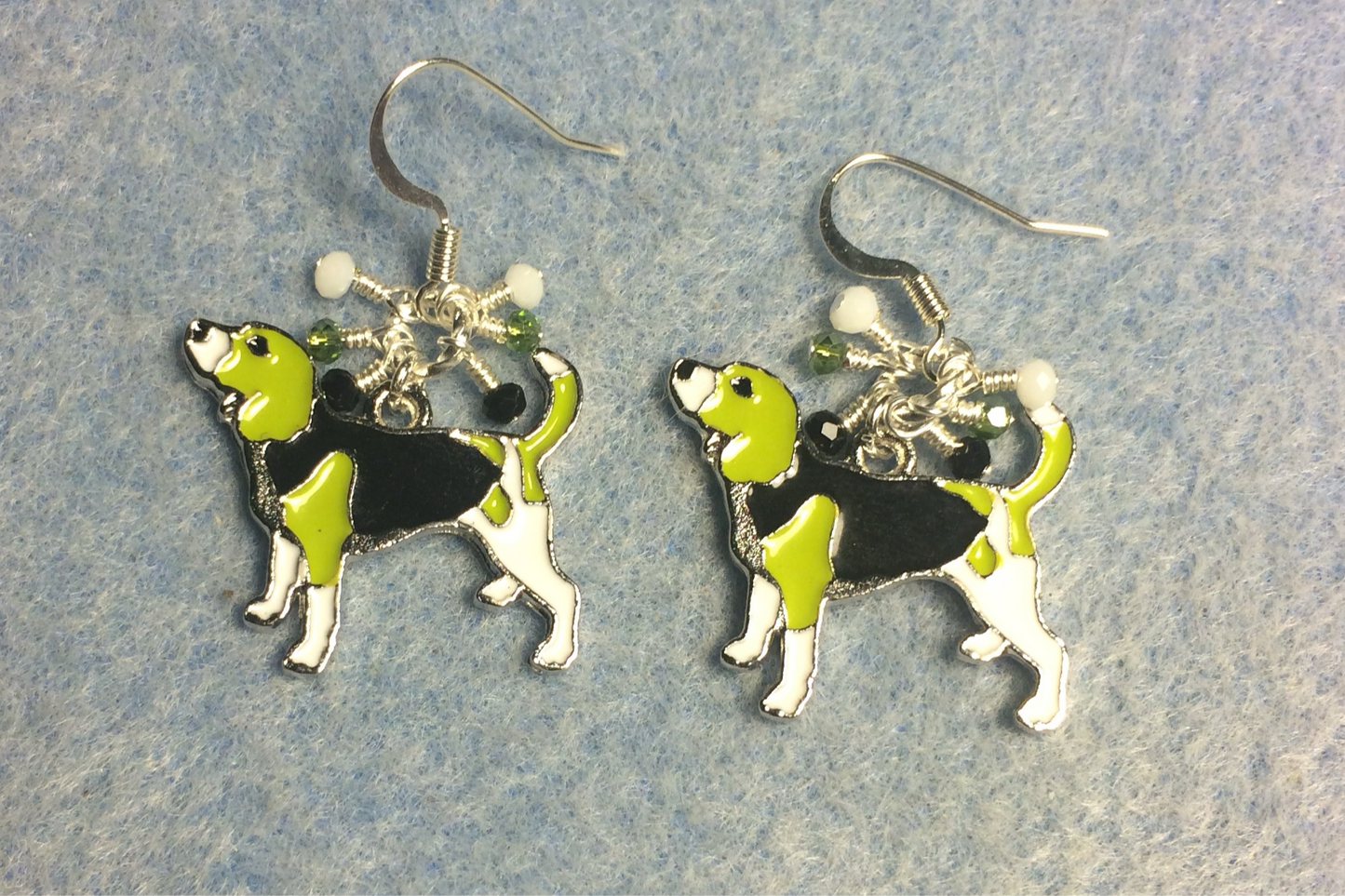 White, black, and olive green enamel beagle charm earrings adorned with tiny dangling white, black, and olive green Chinese crystal beads.