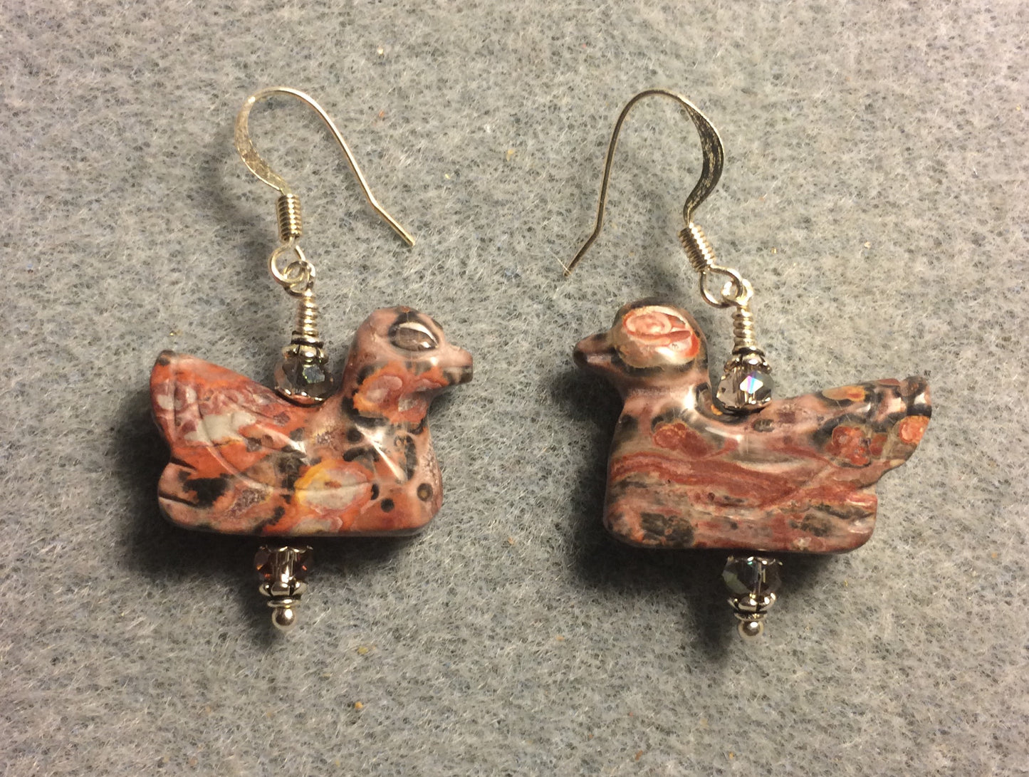 Pink leopard skin jasper gemstone duck bead earrings adorned with pink Chinese crystal beads.