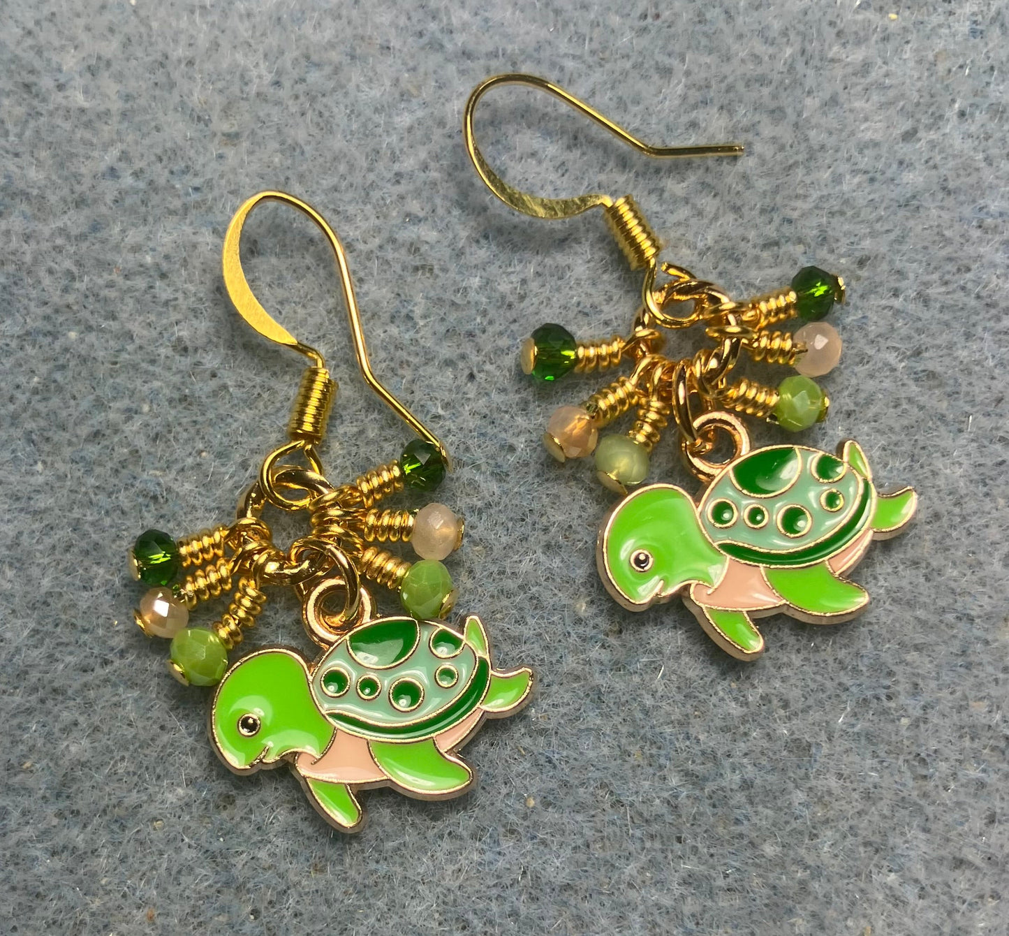 Lime green, peach, and dark green enamel turtle charm earrings adorned with tiny dangling lime green, peach, and dark green Chinese crystal beads.