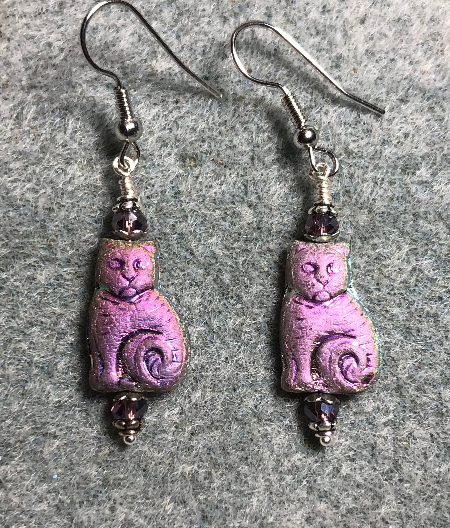 Medium metallic purple pink Czech glass cat bead earrings adorned with purple Chinese crystal beads.