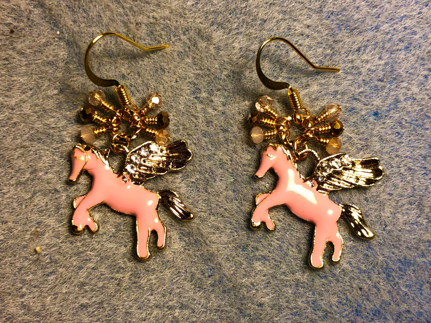 Pink and gold enamel and rhinestone Pegasus (flying horse) charm earrings adorned with tiny dangling pink and gold Chinese crystal beads.