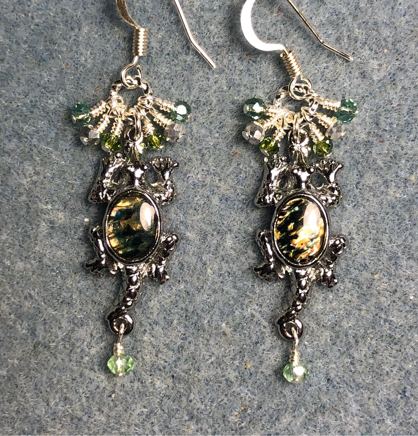 Silver and green abalone alligator charm earrings adorned with tiny dangling green and silver Chinese crystal beads.
