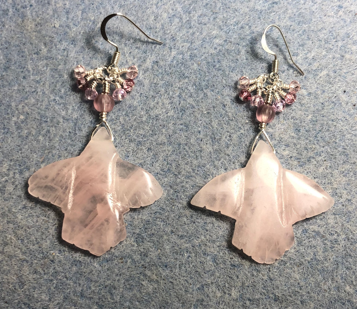 Large rose quartz gemstone flying eagle bead earrings adorned with tiny dangling pink Chinese crystal beads.