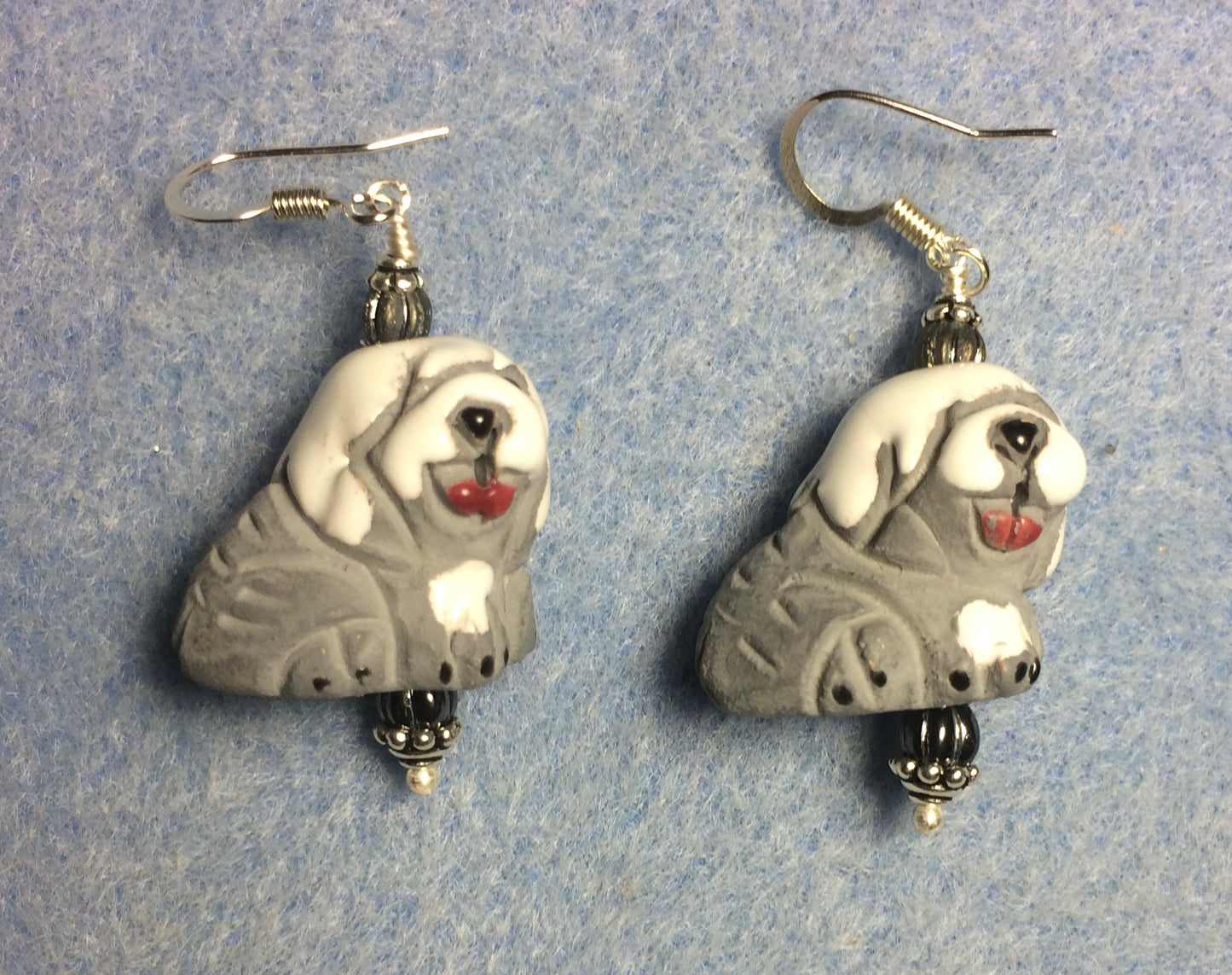 Gray and white ceramic sheepdog bead earrings adorned with gray Czech glass beads.