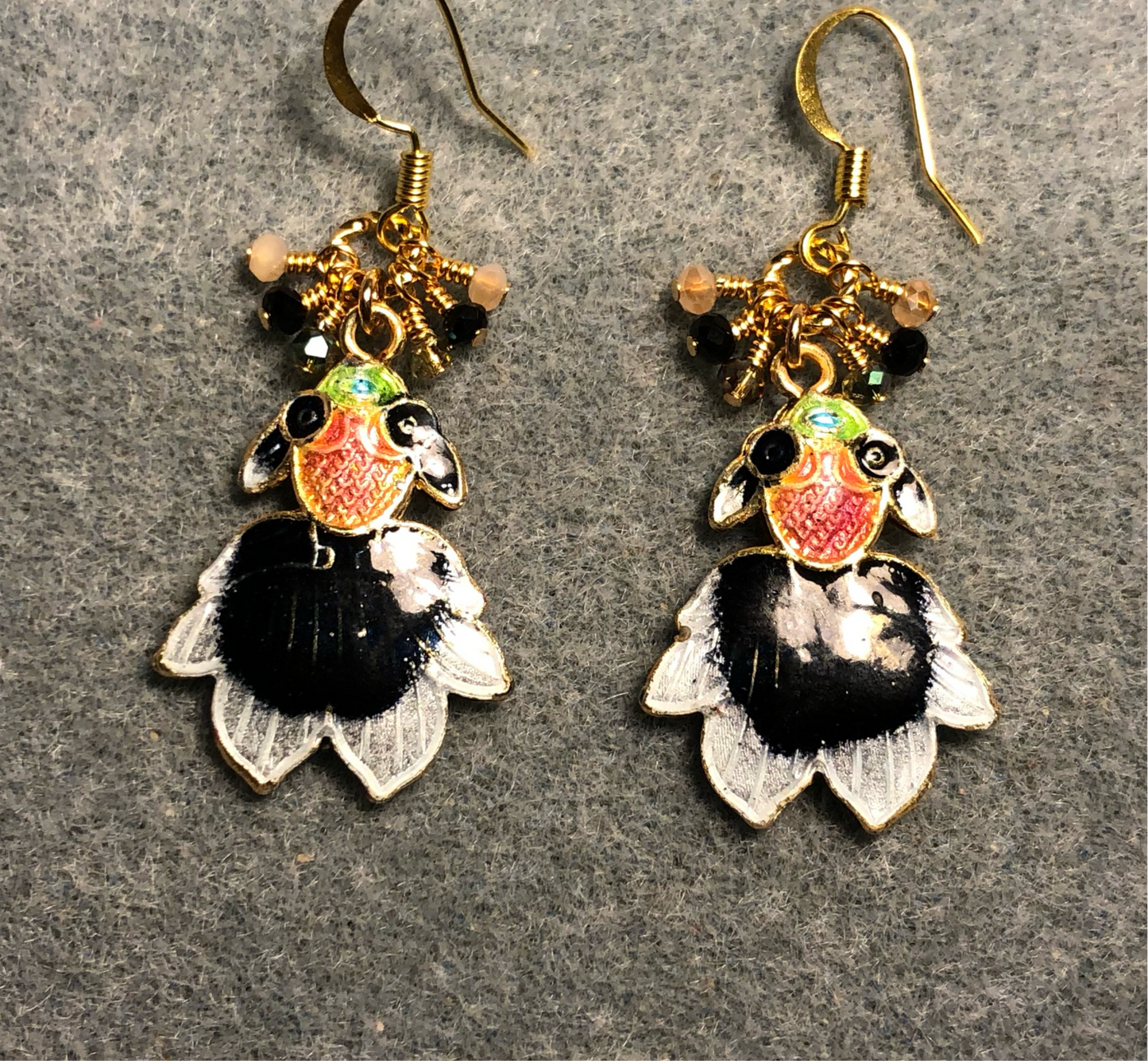 Black, peach, and green cloisonné goldfish charm earrings adorned with tiny dangling black, peach, and green Chinese crystal beads.