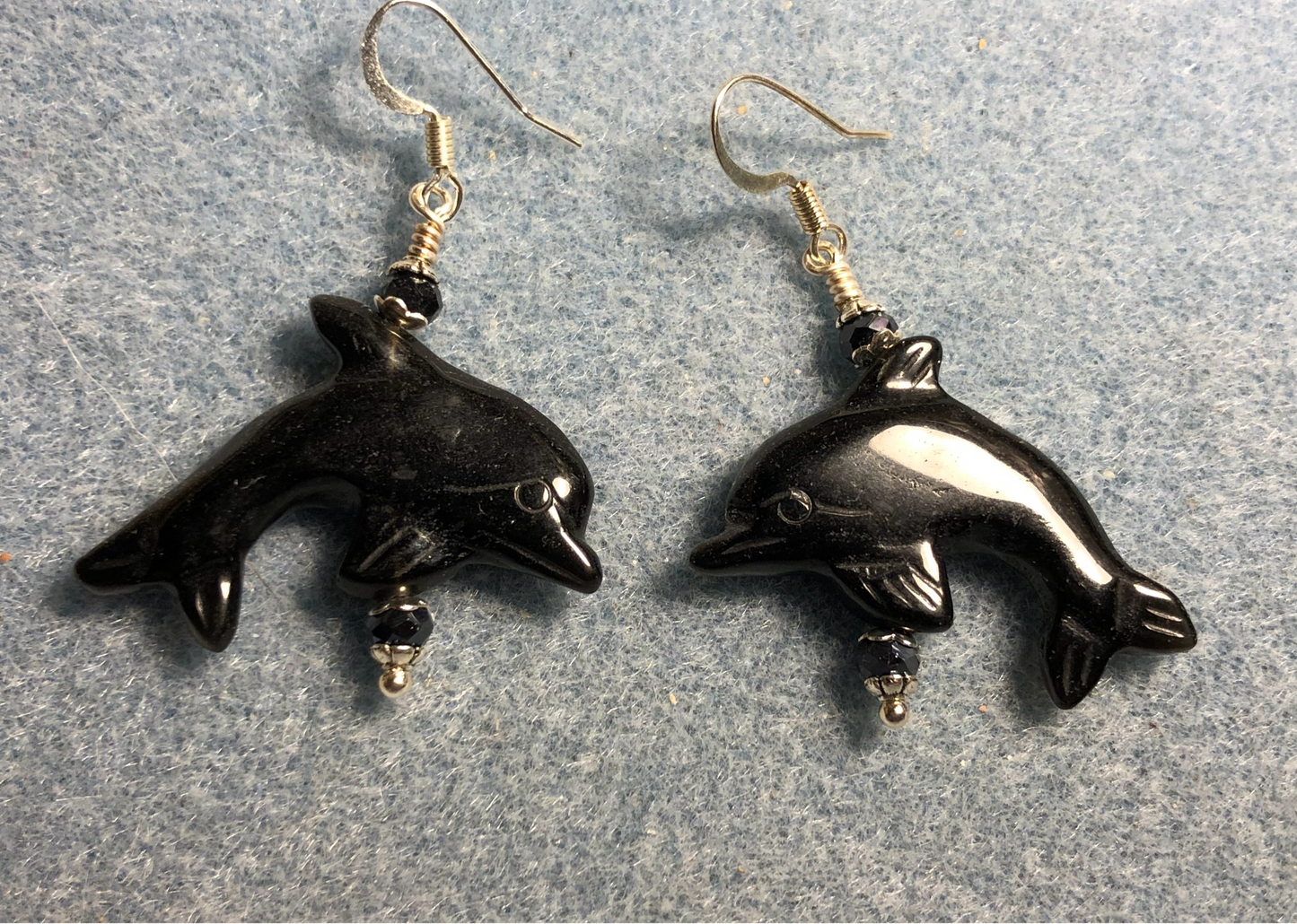 Black onyx gemstone dolphin bead earrings adorned with black Chinese crystal beads.