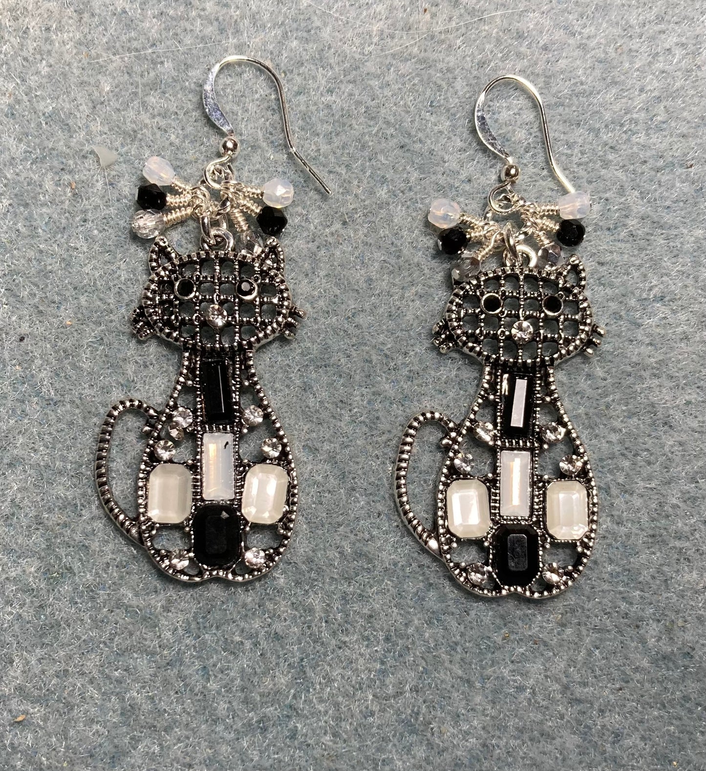Large black, white, and gray enamel and rhinestone cat charm earrings adorned with small dangling black, white, and gray Czech glass beads.