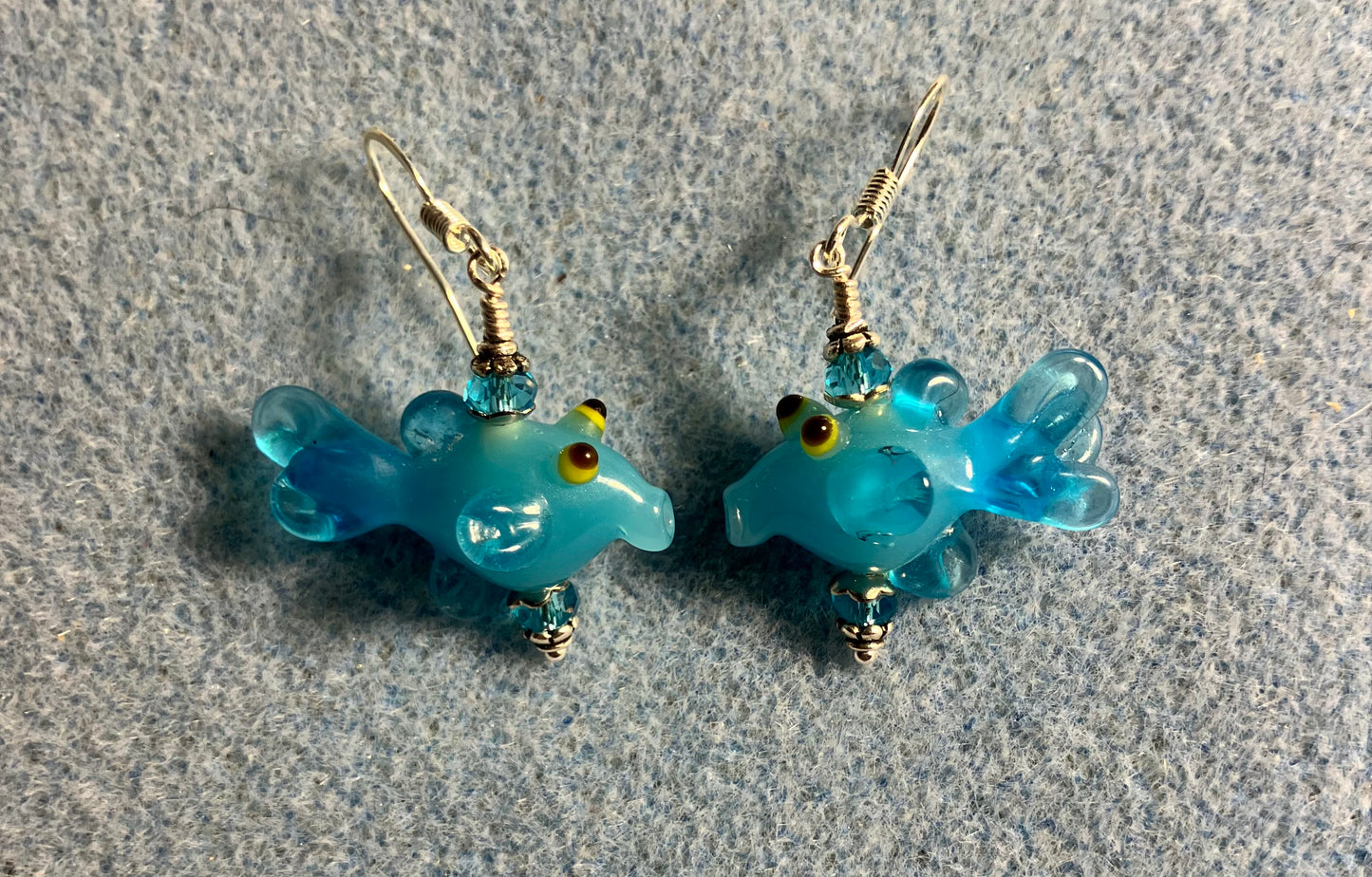 Turquoise lamp work fish bead earrings adorned with turquoise Chinese crystal beads.