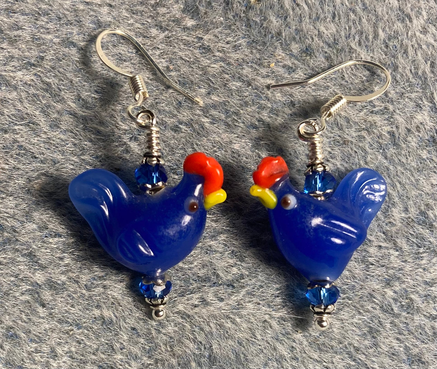 Dark blue lamp work chicken bead earrings adorned with dark blue Chinese crystal beads.