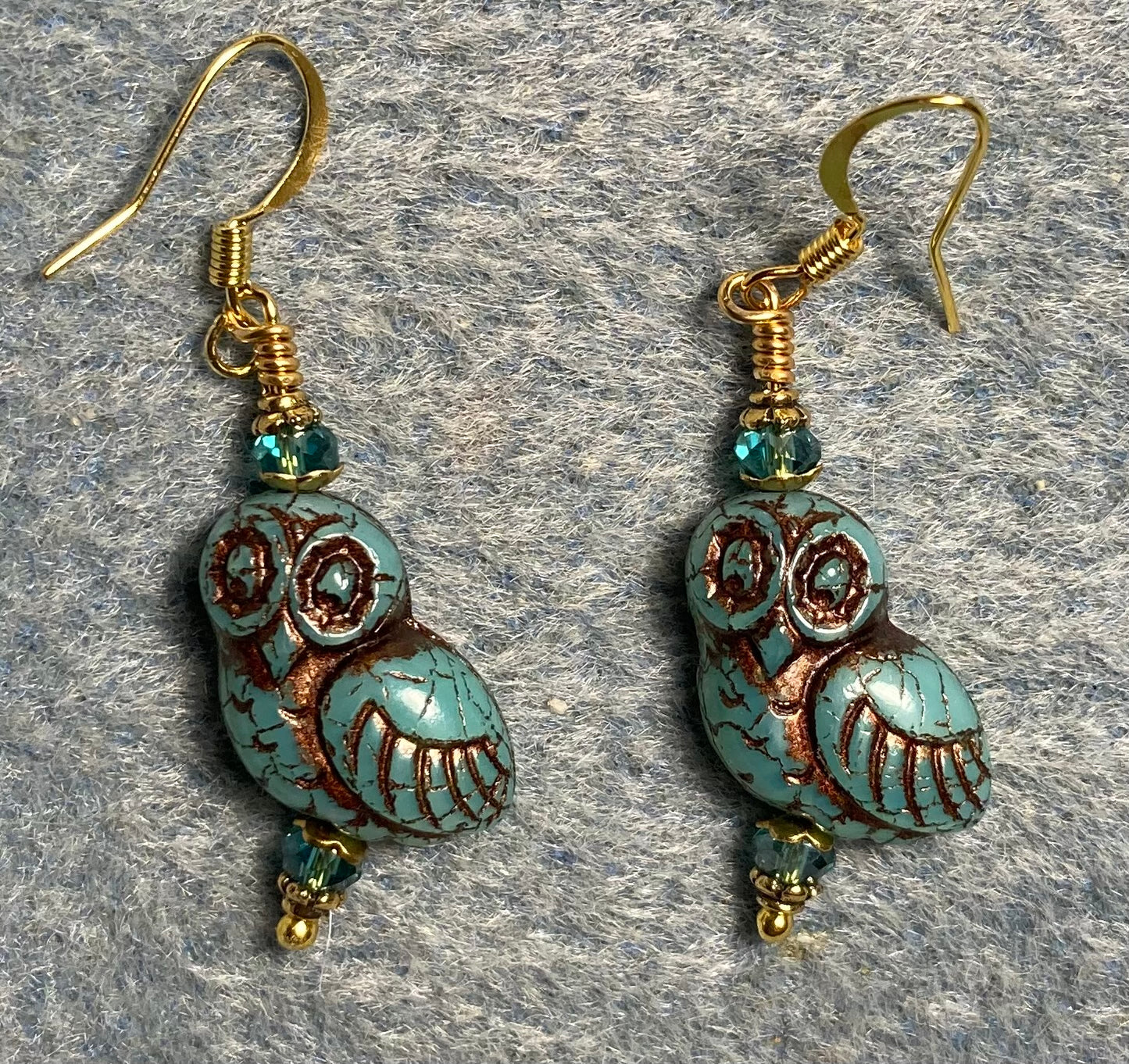 Turquoise (with copper wash) fancy Czech glass owl bead earrings adorned with turquoise Chinese crystal beads.