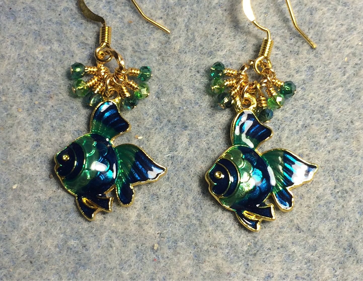 Teal and green enamel angelfish charm earrings adorned with tiny dangling teal and green Chinese crystal beads.