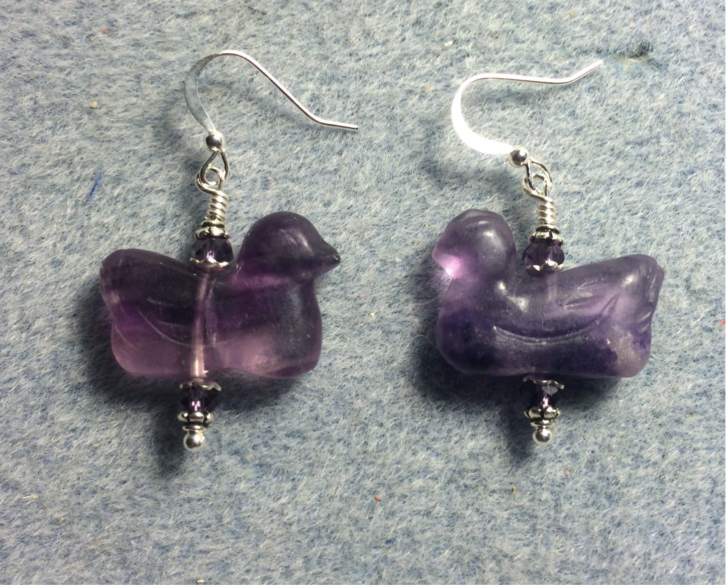 Dark purple fluorite gemstone duck bead earrings adorned with dark purple Chinese crystal beads.