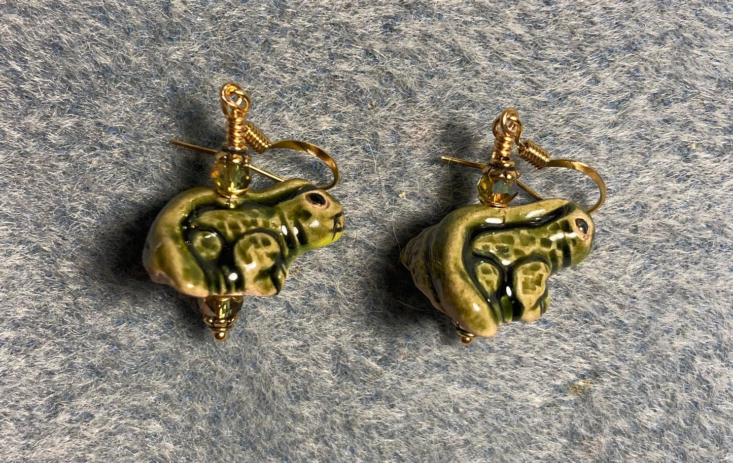Small olive green ceramic lizard bead earrings adorned with sparkly olive green Chinese crystal beads.
