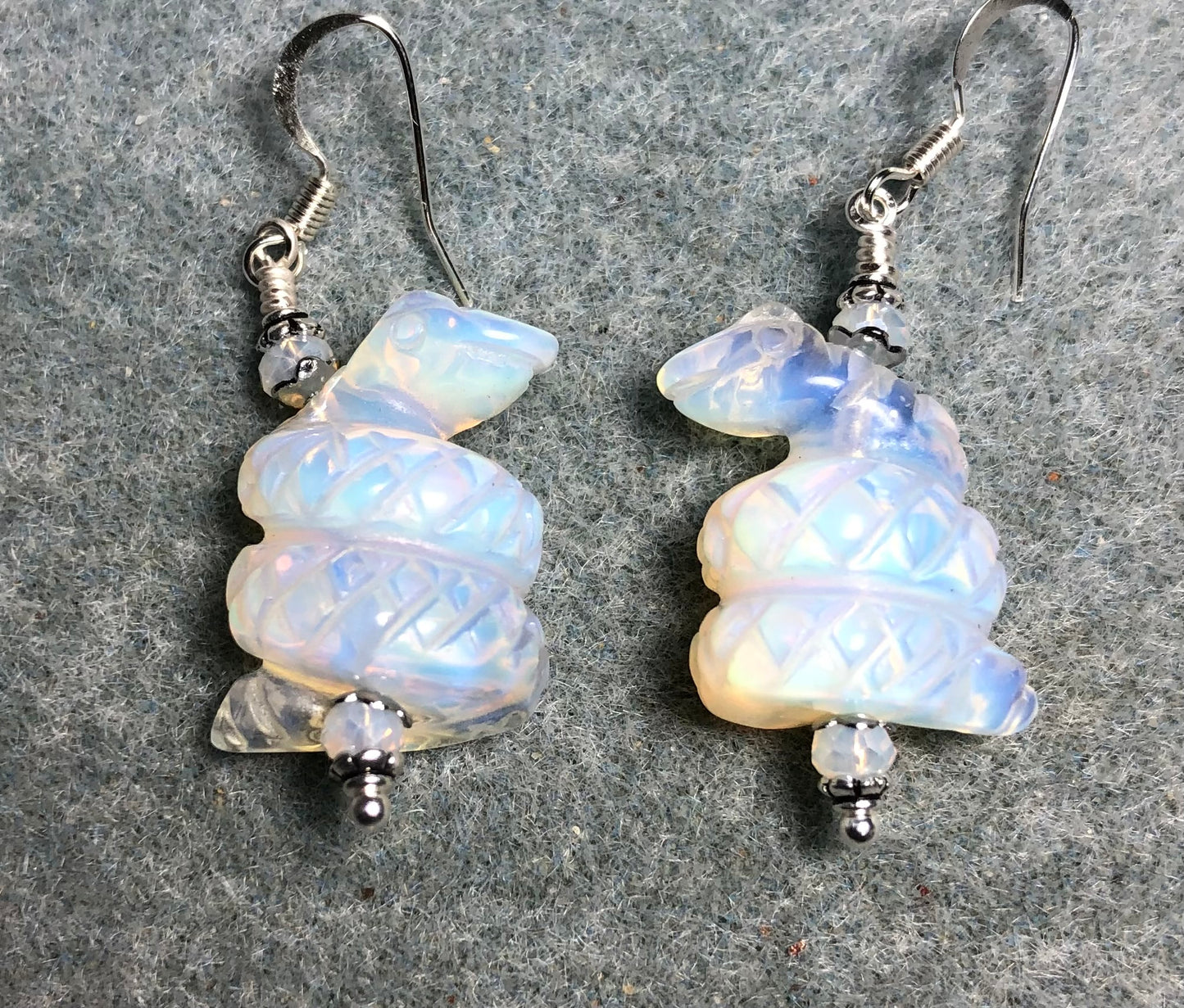 Opalite gemstone coiled snake bead earrings adorned with white Chinese crystal beads.