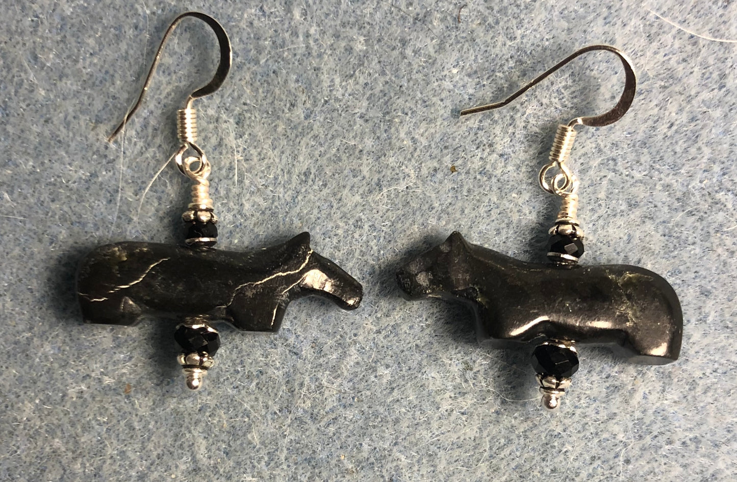 Small black onyx gemstone horse bead earrings adorned with black Chinese crystal beads.
