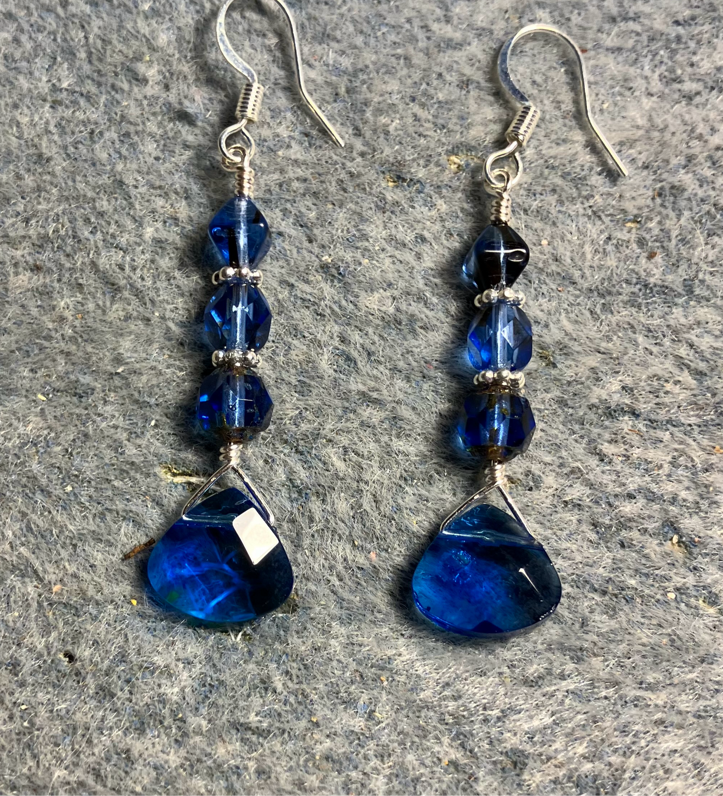 Capri blue Czech glass briolette bead earrings adorned with capri blue Czech glass beads.