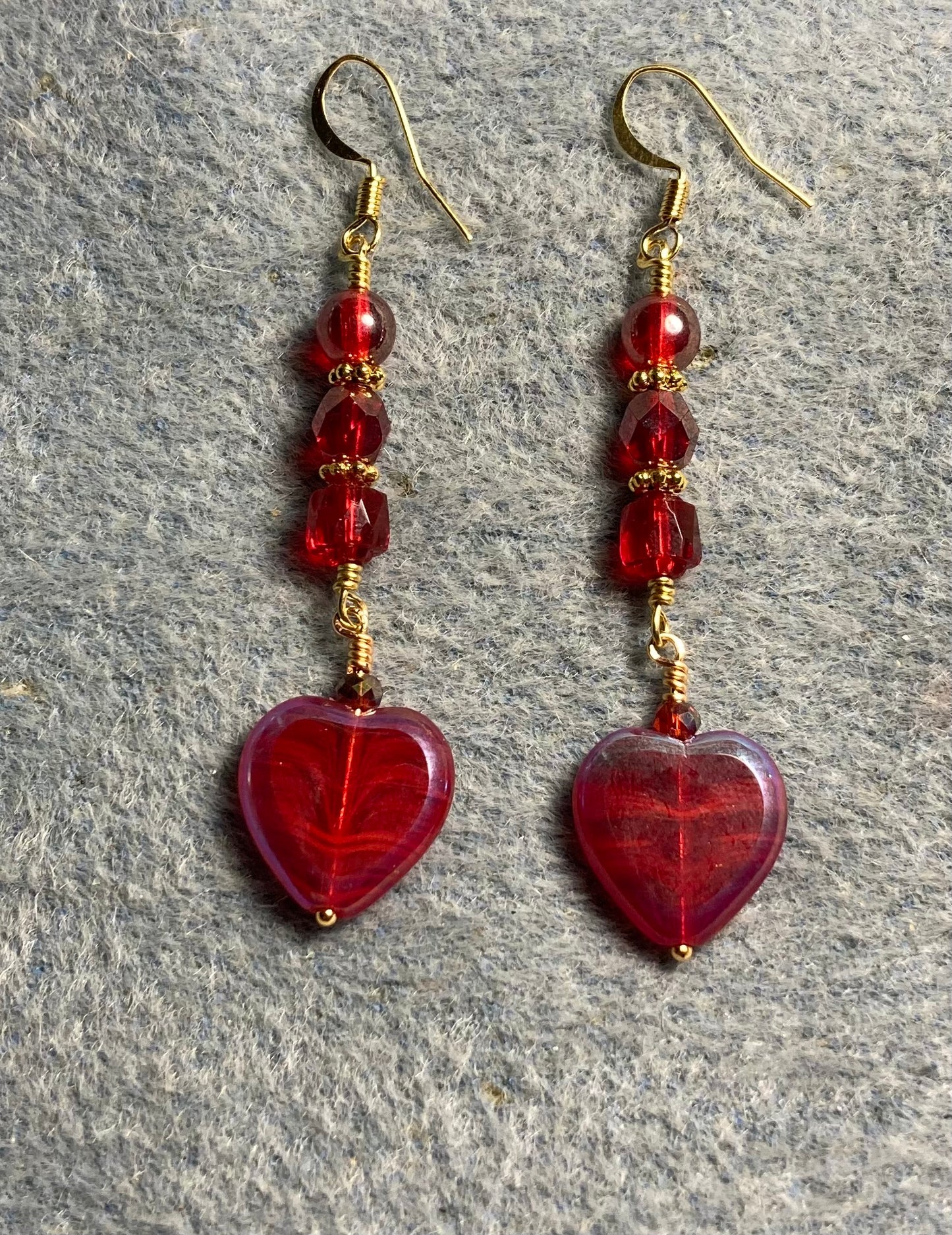 Dark red Czech glass heart bead earrings adorned with dark red Czech glass beads.