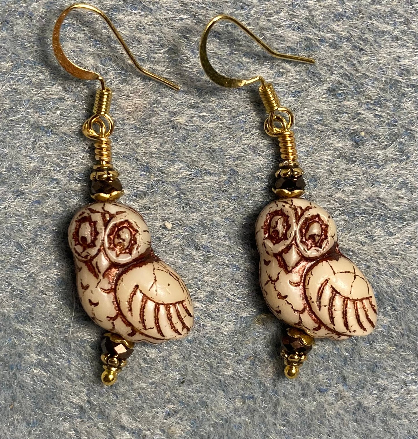 Beige (with brown wash) fancy Czech glass owl bead earrings adorned with brown Chinese crystal beads.