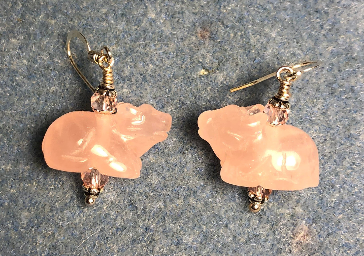 Small pink rose quartz gemstone ox bead earrings adorned with pink Chinese crystal beads.