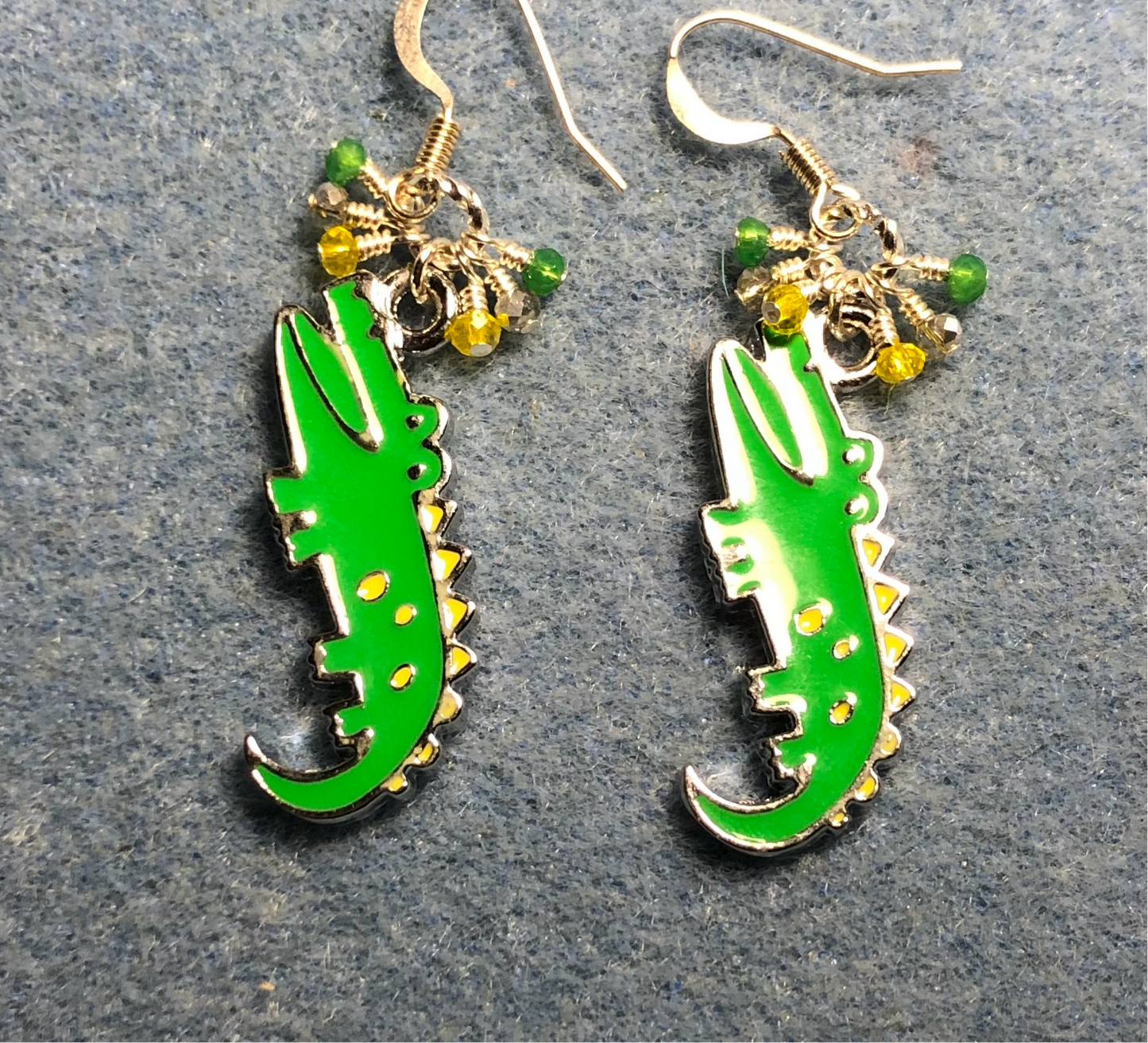 Green and yellow enamel alligator charm earrings adorned with tiny dangling green, yellow, and silver Chinese crystal beads.
