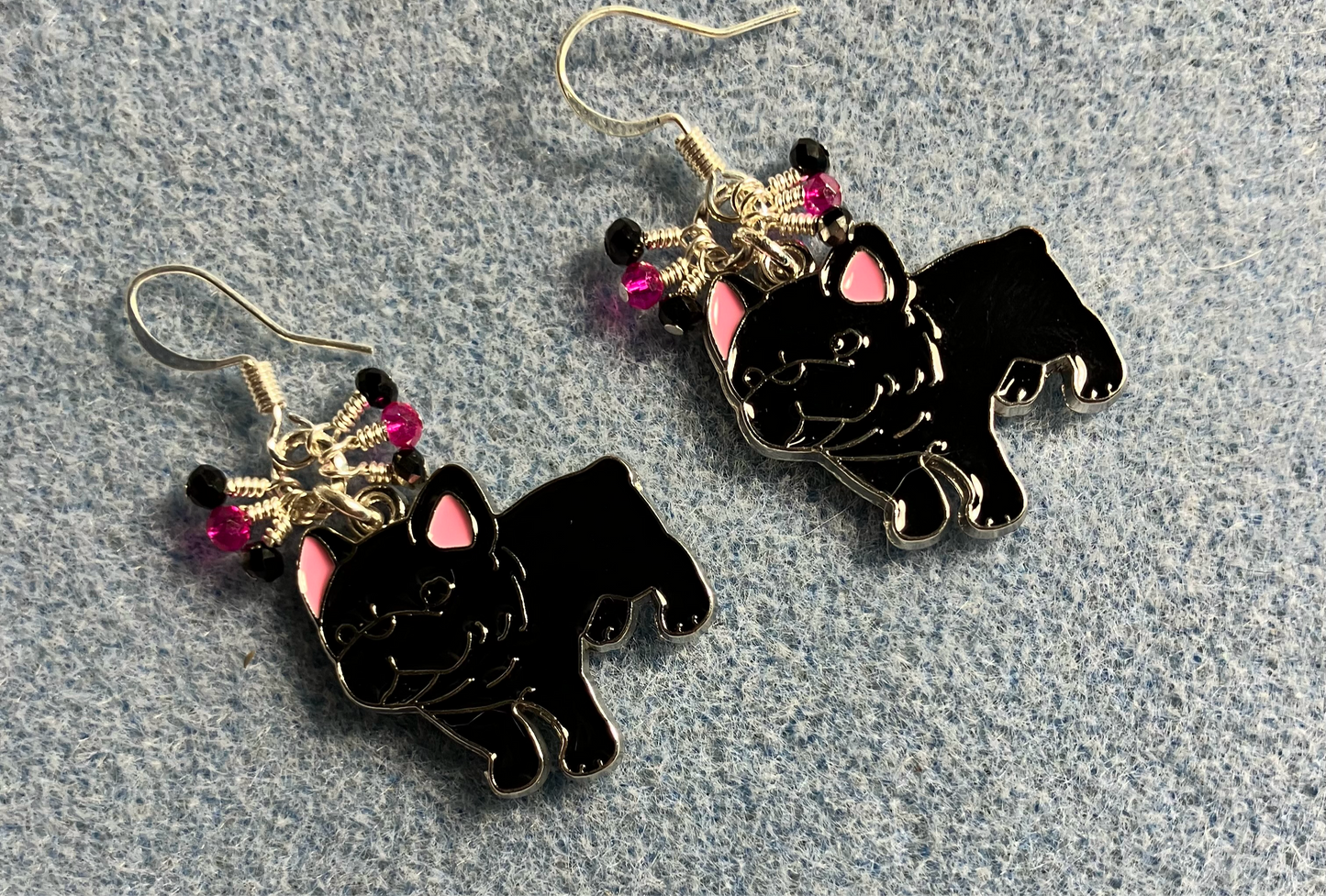 Black and pink enamel French bulldog charm earrings adorned with tiny dangling black and pink Chinese crystal beads.