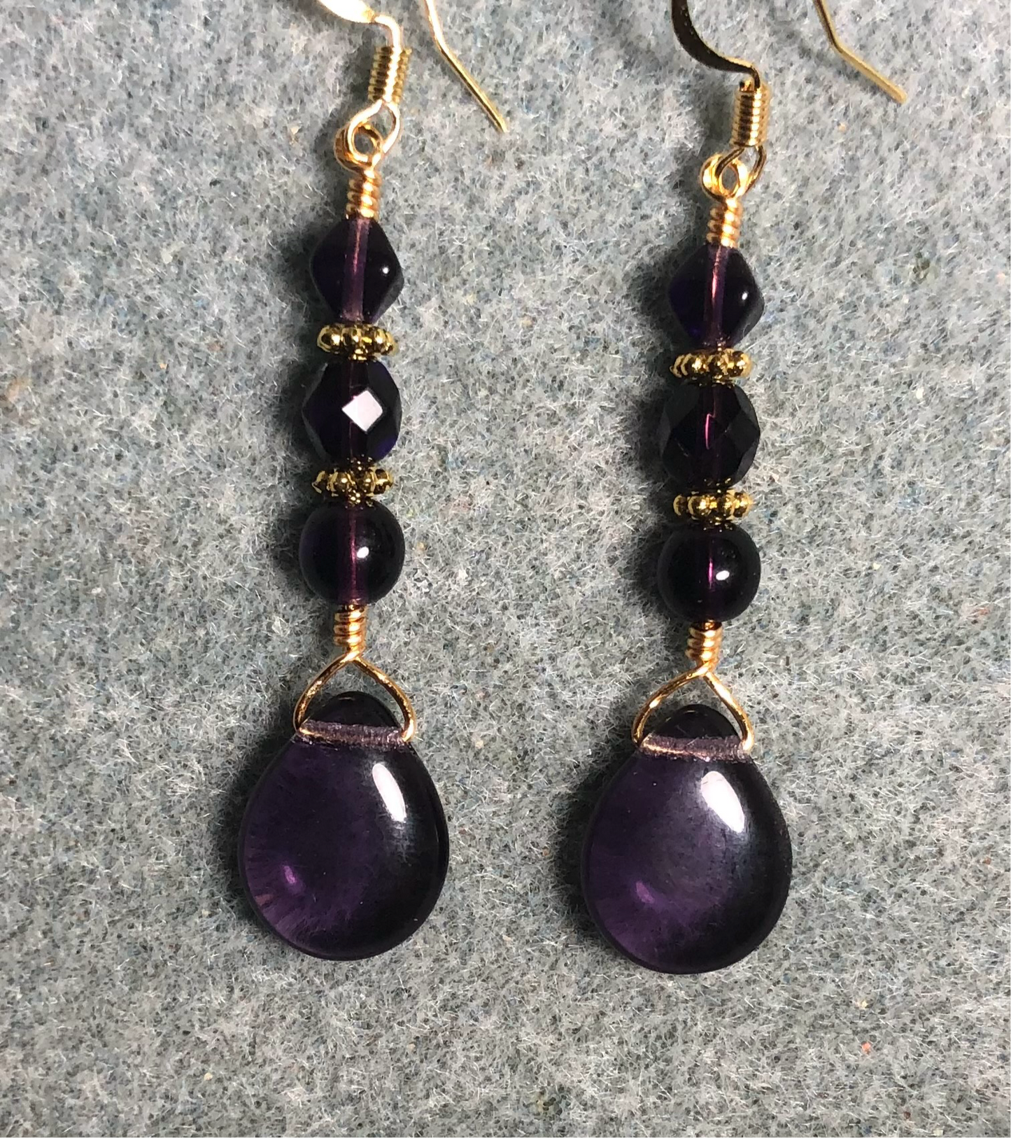 Grape purple Czech glass pear drop bead earrings adorned with grape purple Czech glass beads.