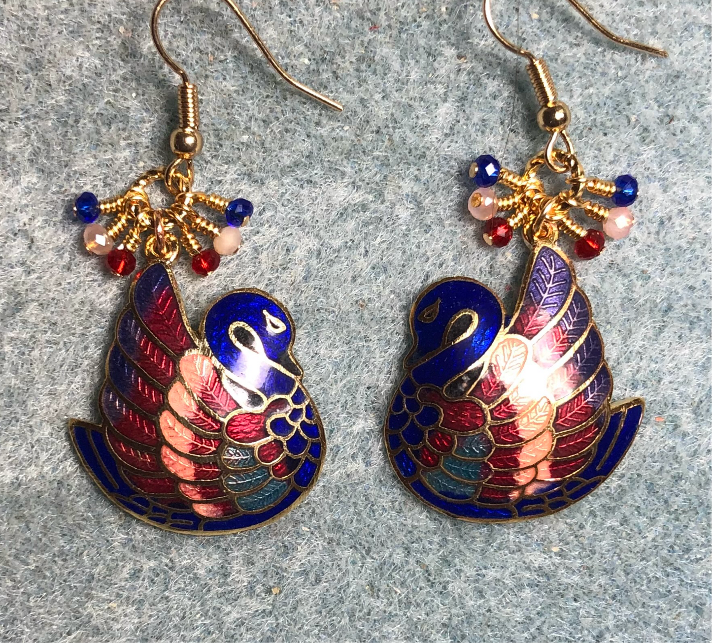 Gorgeous vintage dark blue, red, and peach cloisonné swan charm earrings adorned with tiny dangling dark blue, red, and peach Chinese crystal beads.