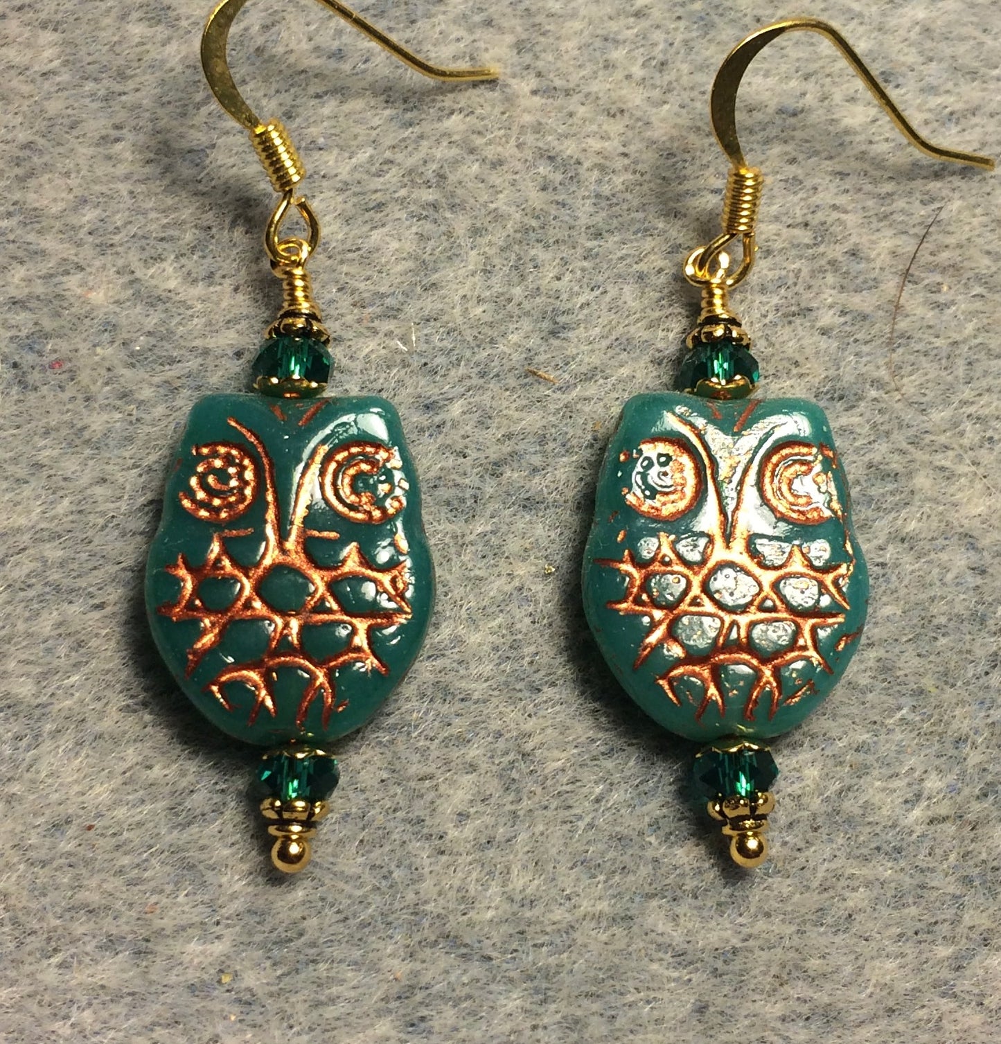 Teal (with copper wash) Czech glass owl bead earrings adorned with teal Chinese crystal beads.