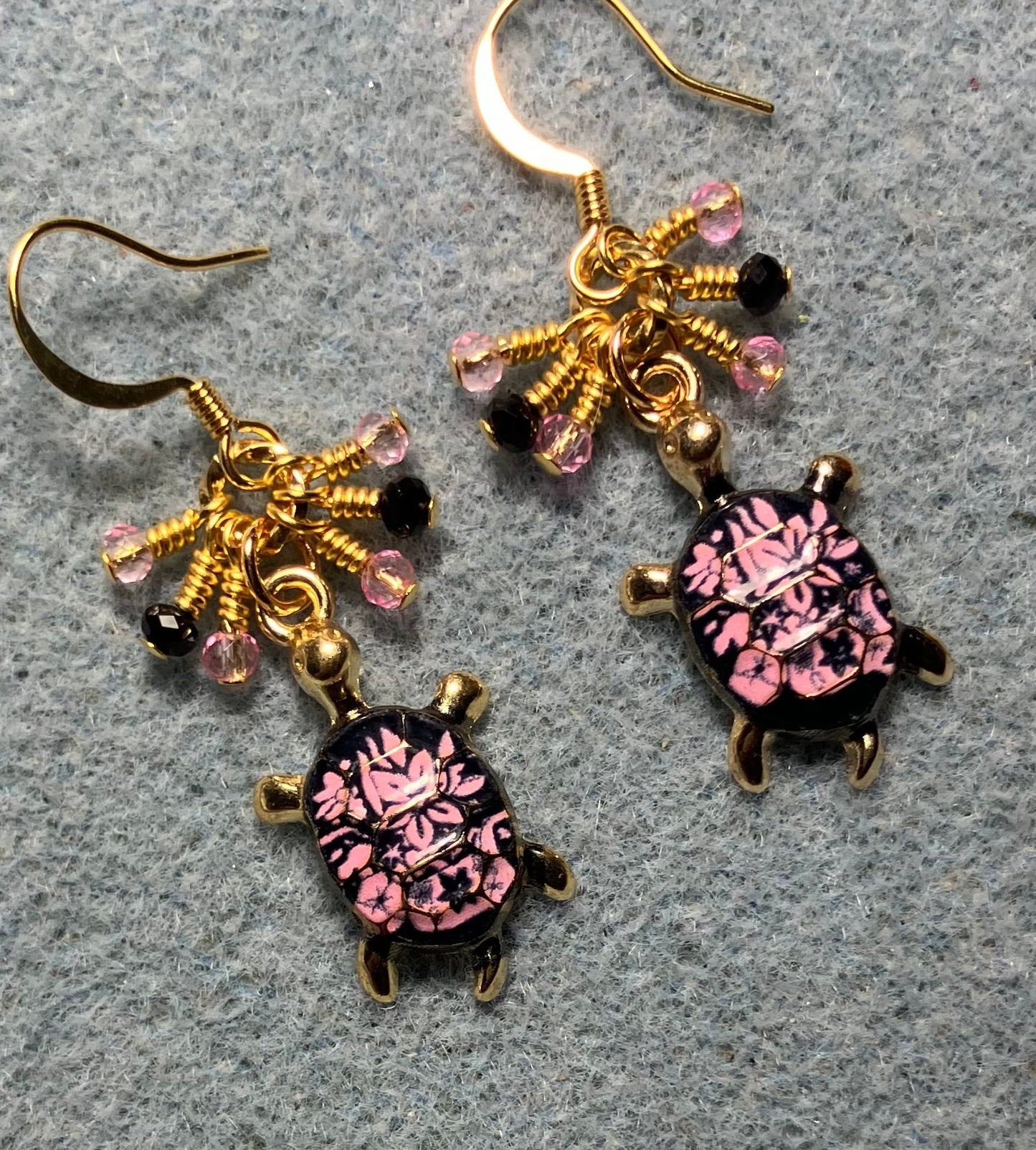 Pink and black enamel turtle charm earrings adorned with tiny dangling pink and black Chinese crystal beads.