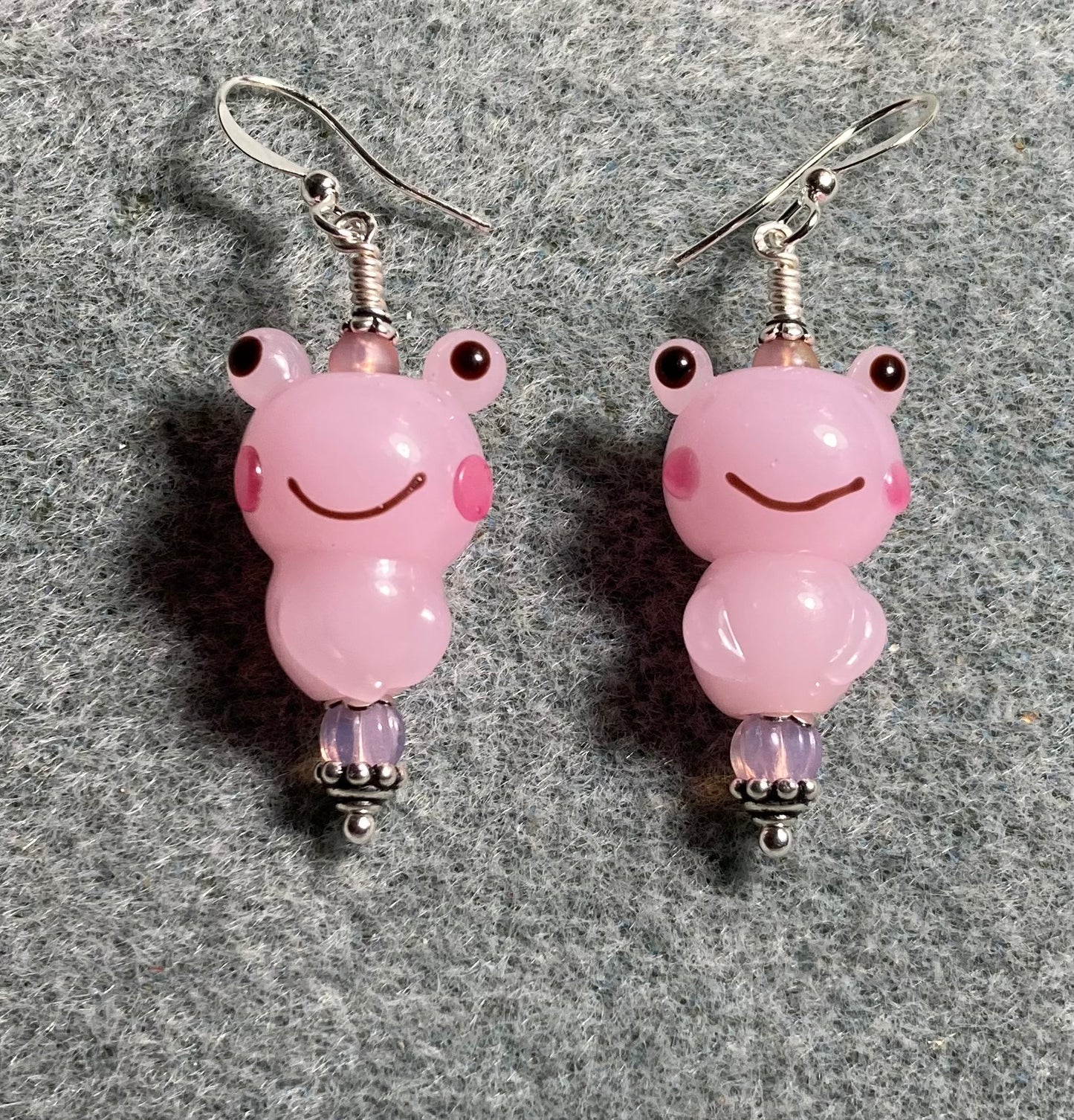 Pink lamp work silly frog bead earrings adorned with pink Czech glass beads.