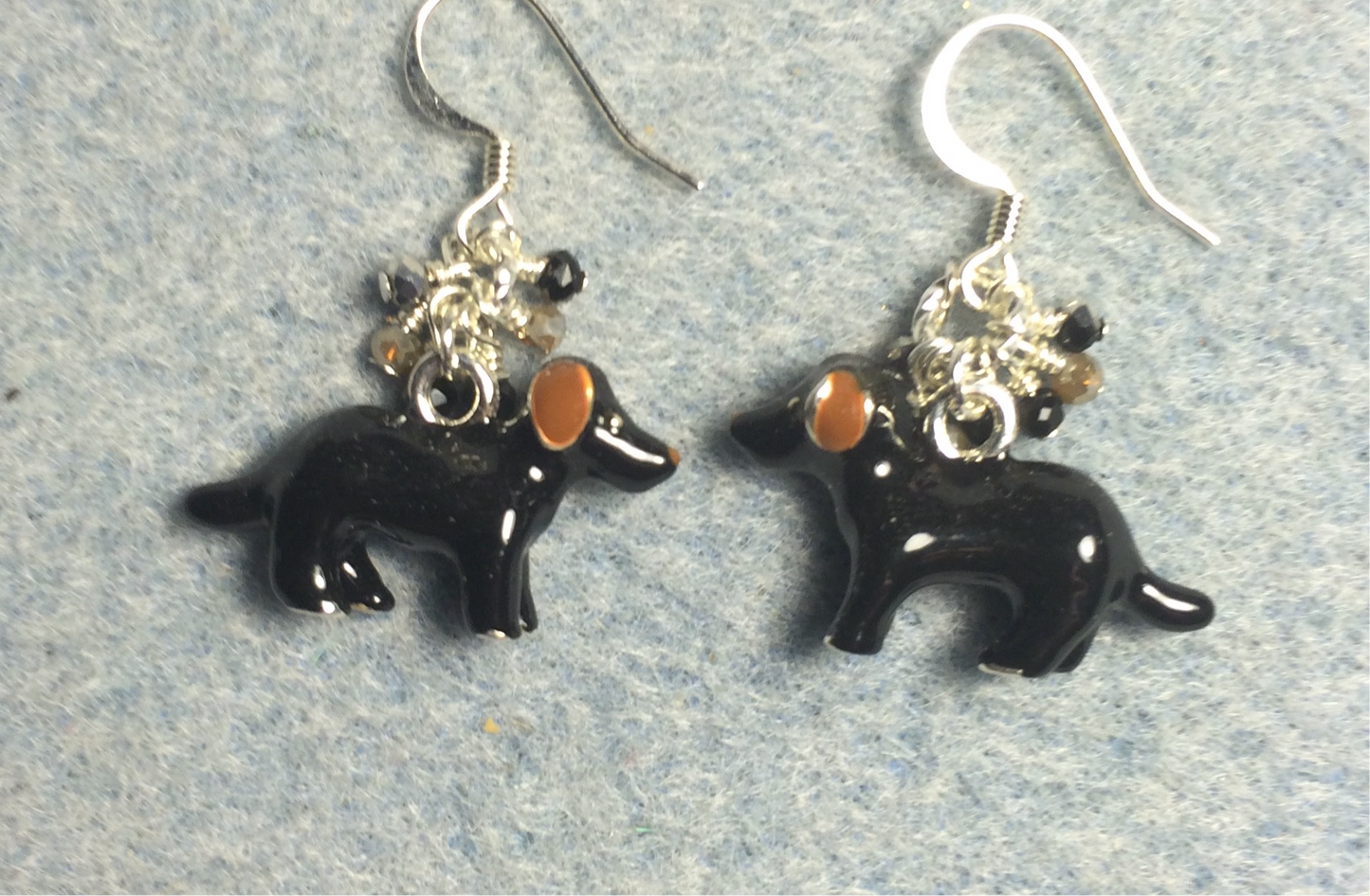 Black and tan enamel dog charm earrings adorned with tiny dangling black and tan Chinese crystal beads.
