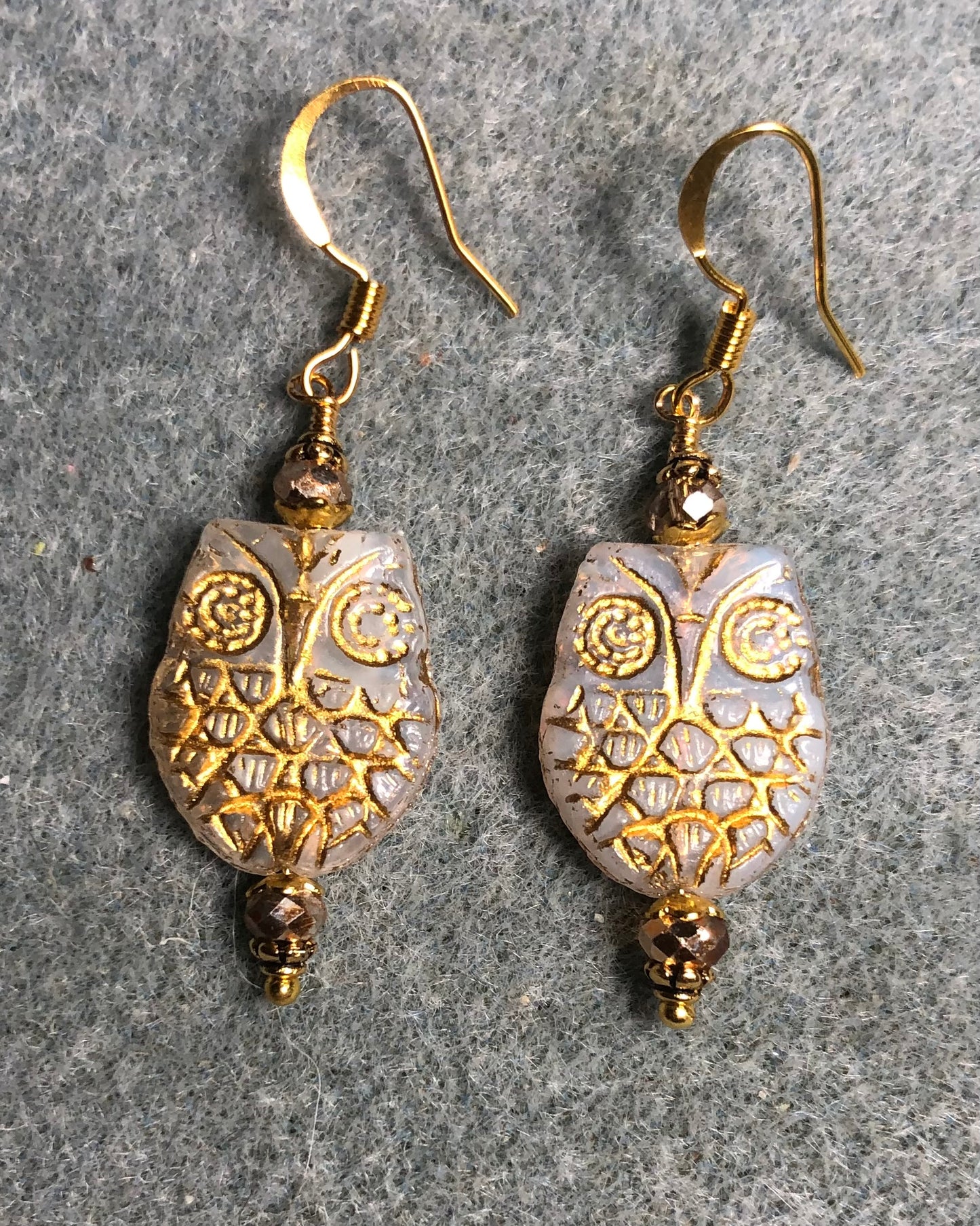 White (with gold wash) Czech glass owl bead earrings adorned with gold Chinese crystal beads.