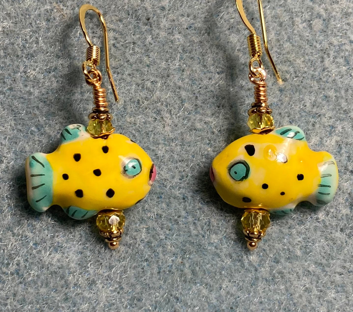 Small yellow and blue ceramic fish bead earrings adorned with yellow Chinese crystal beads.