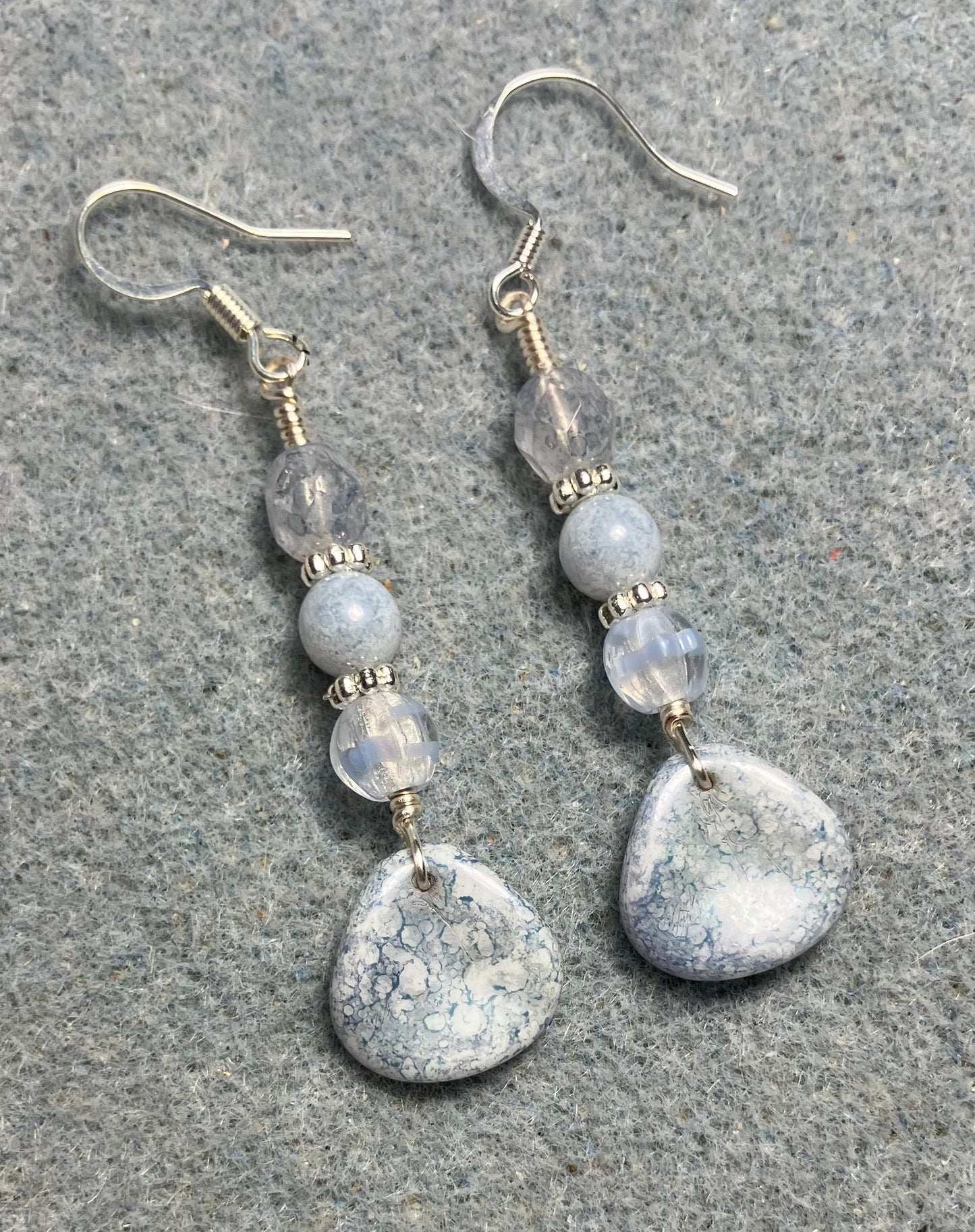 Light blue speckled Czech glass rose petal earrings adorned with light blue Czech glass beads.