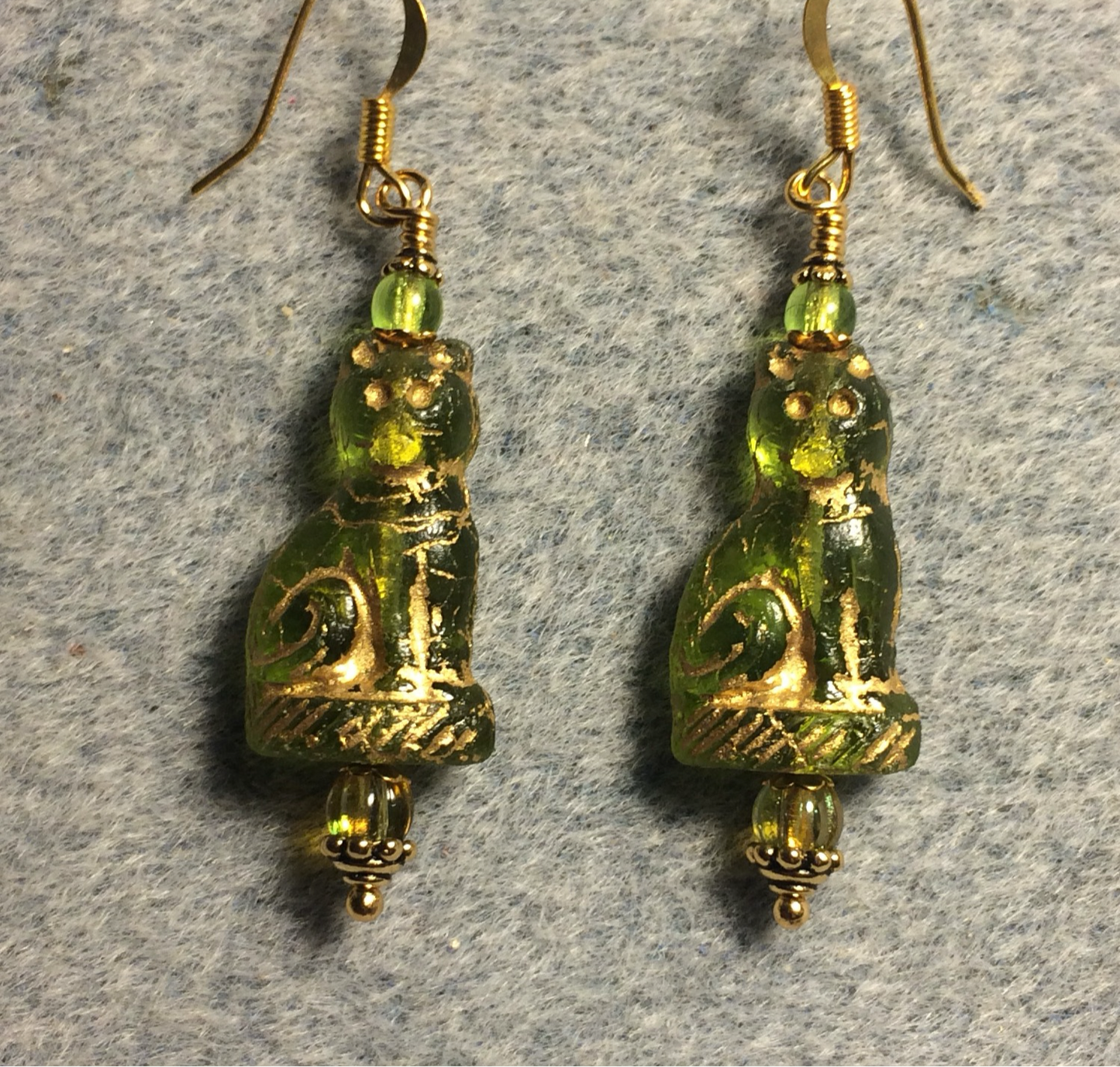 Olive green (with gold inlay) fancy Czech glass cat bead earrings adorned with olive green Czech glass beads.
